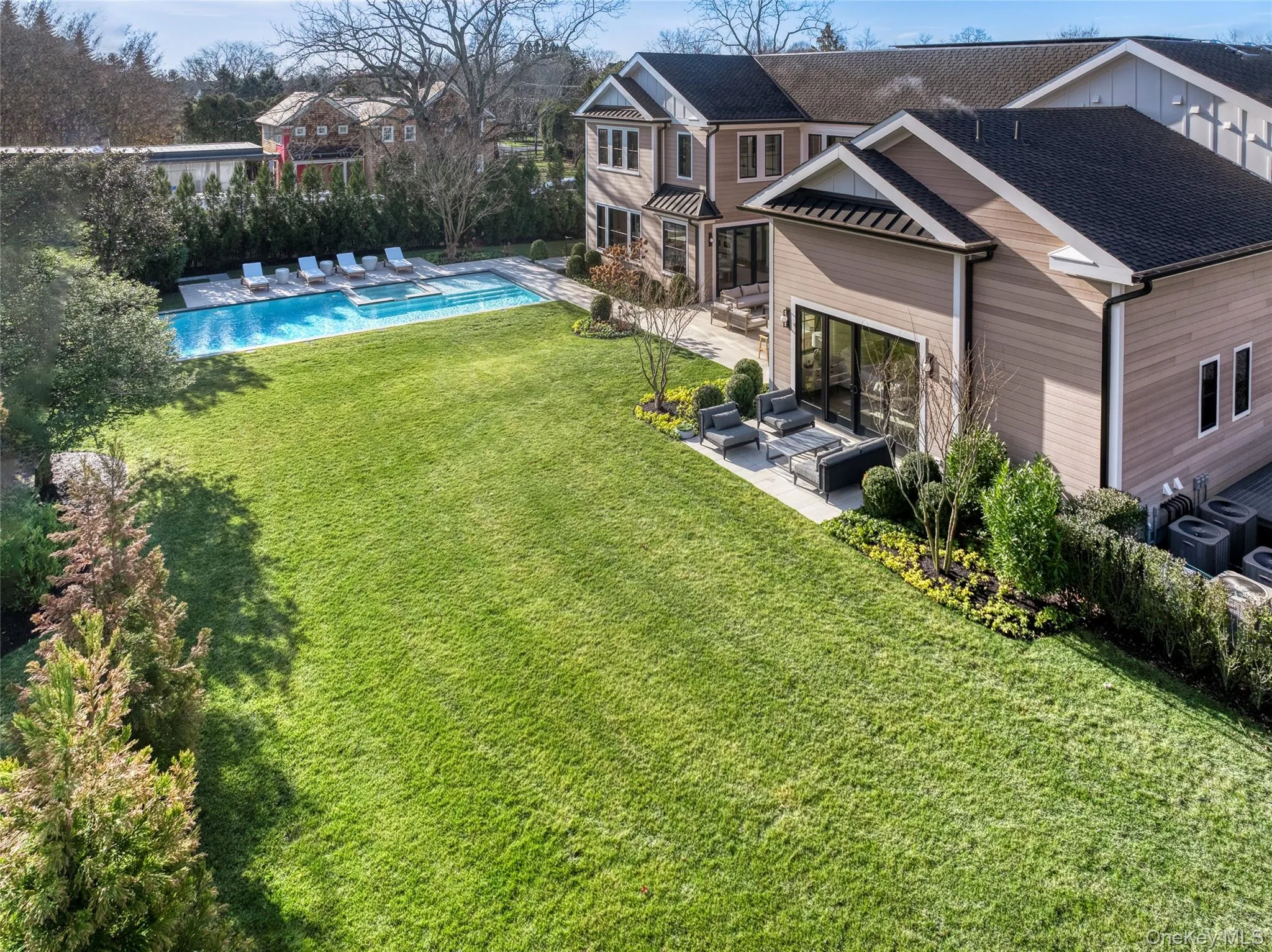 View of green lawn with a patio, an outdoor hangout area, and an outdoor pool View of green lawn with a patio, an outdoor hangout area, and an outdoor pool