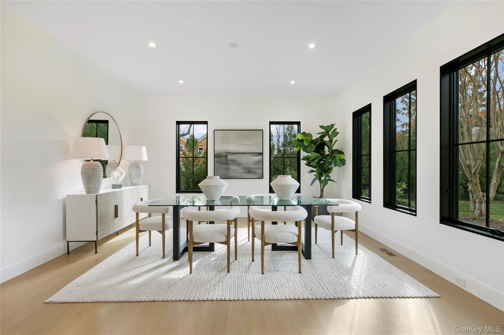 Dining space featuring light wood-style flooring and recessed lighting Dining space featuring light wood-style flooring and recessed lighting
