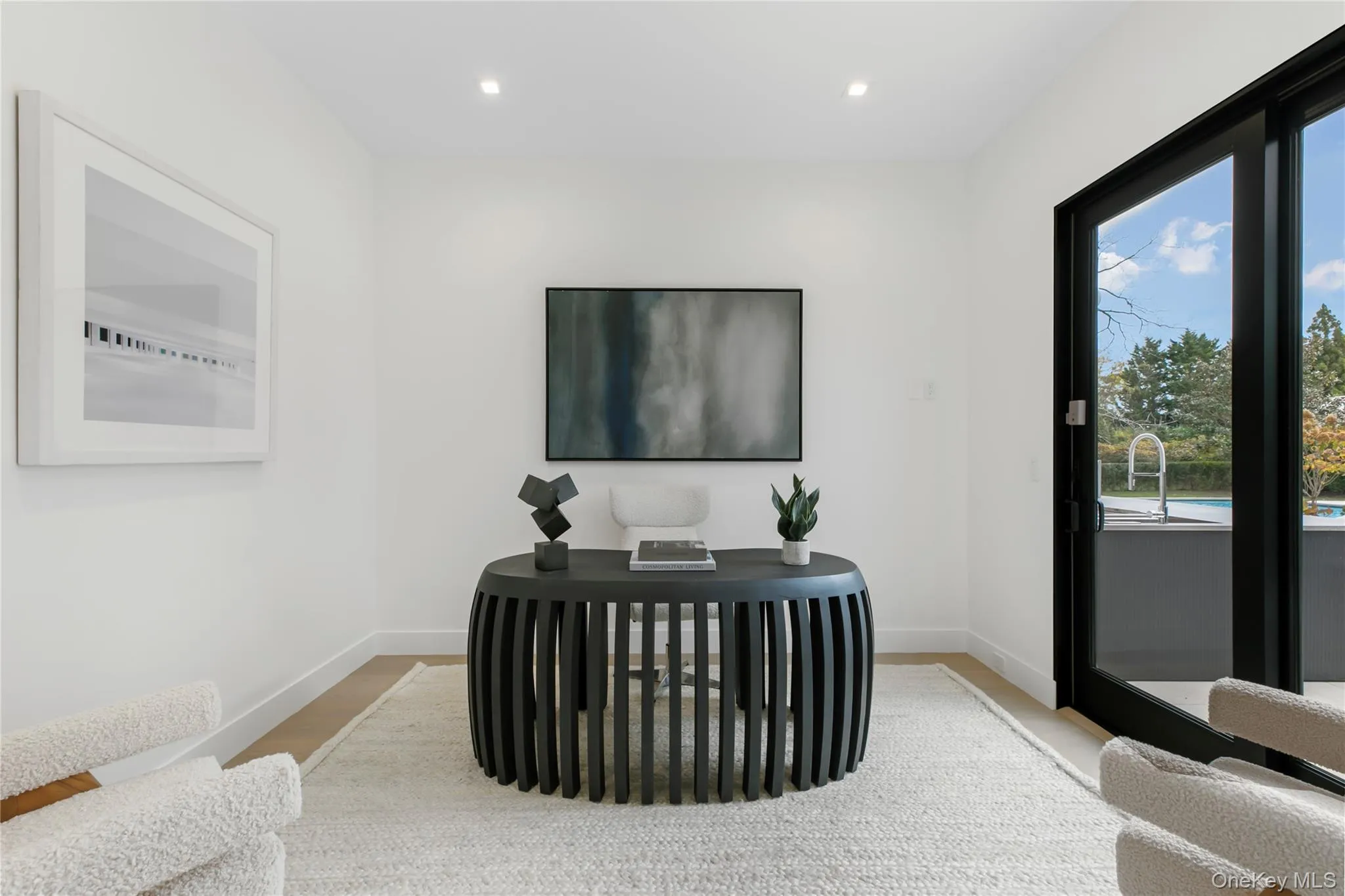 Sitting room with recessed lighting, wood finished floors, and a desk Sitting room with recessed lighting, wood finished floors, and a desk