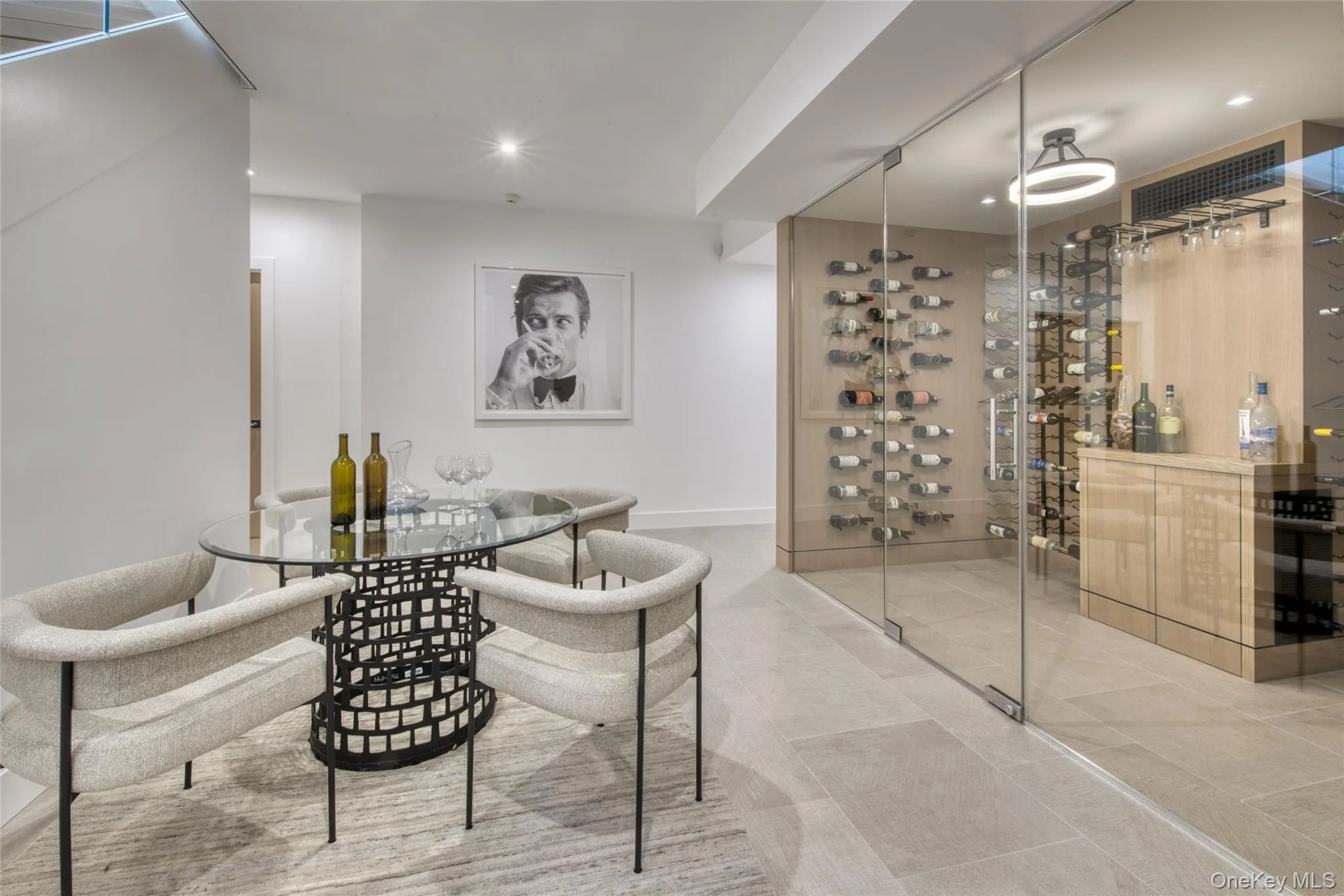 Wine room with recessed lighting and baseboards Wine room with recessed lighting and baseboards