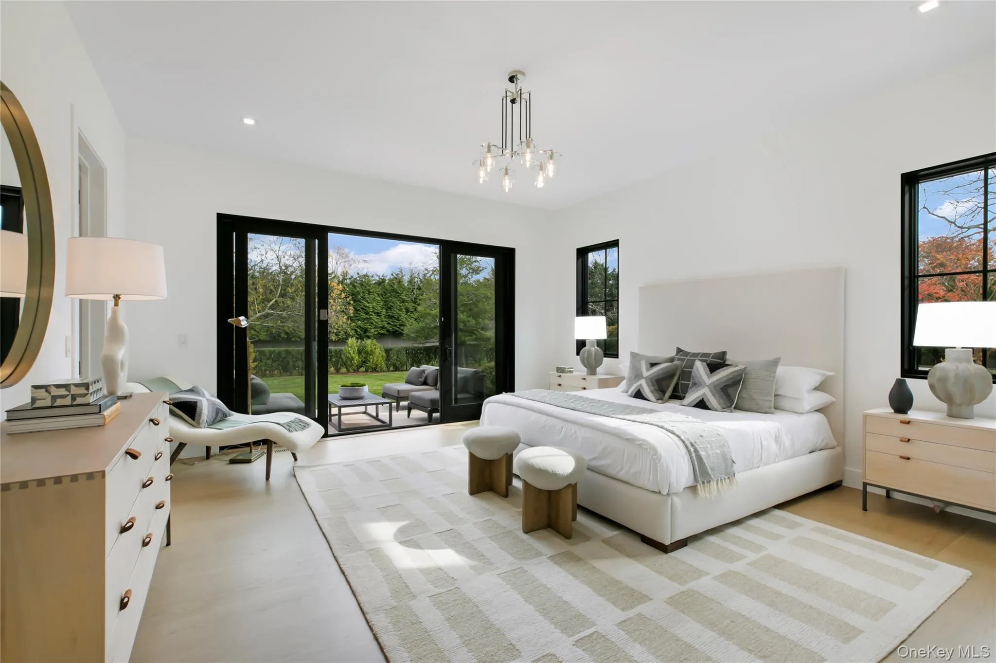 Bedroom featuring recessed lighting, access to outside, and light wood-style flooring Bedroom featuring recessed lighting, access to outside, and light wood-style flooring