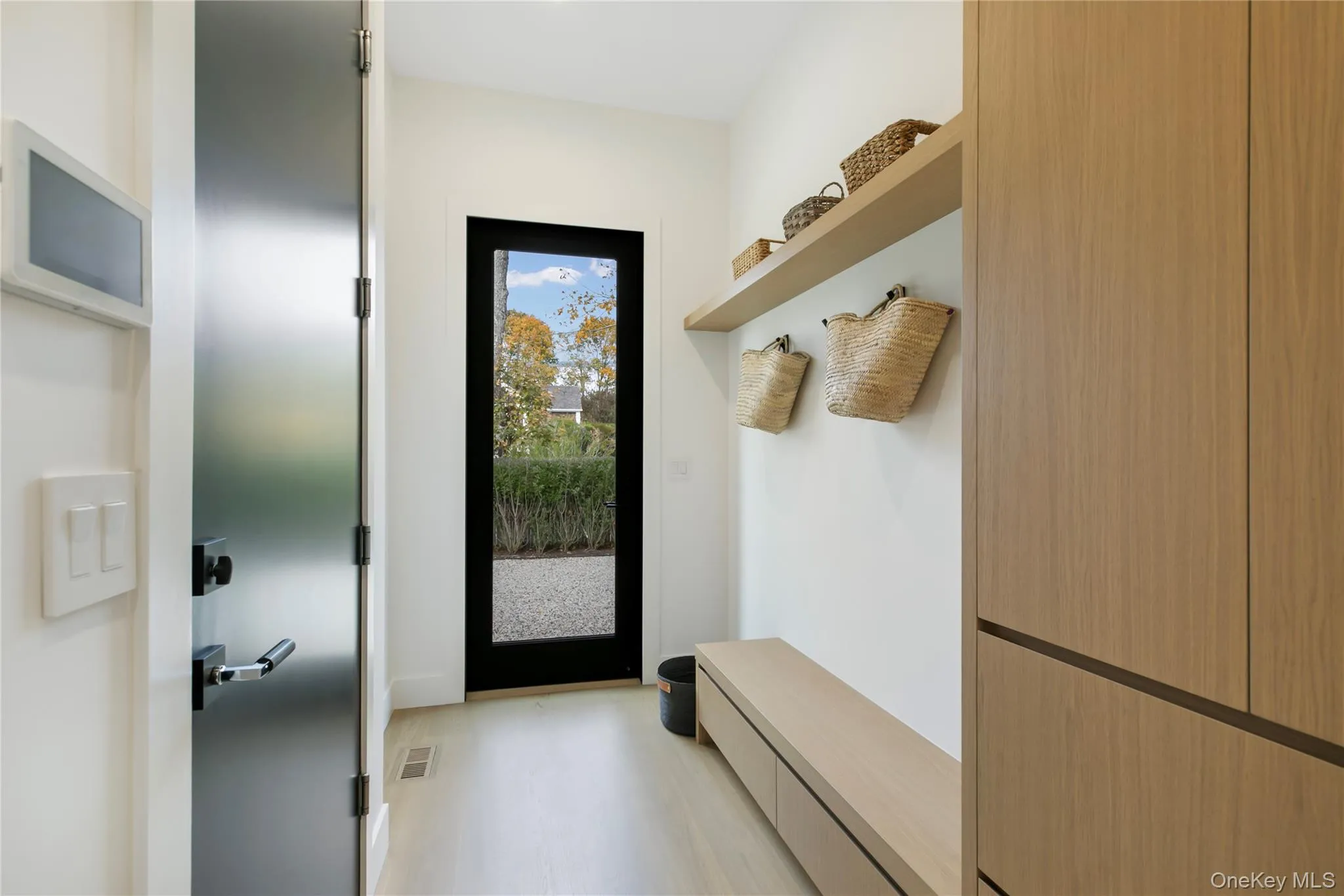 Mudroom with light wood finished floors Mudroom with light wood finished floors