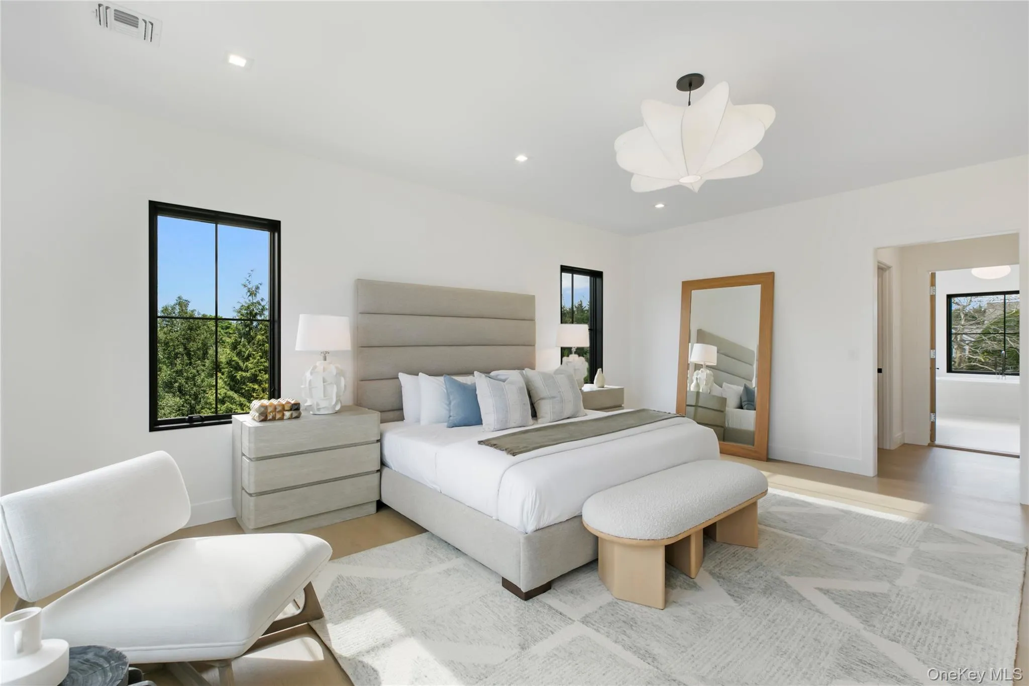 Bedroom featuring recessed lighting and wood finished floors Bedroom featuring recessed lighting and wood finished floors