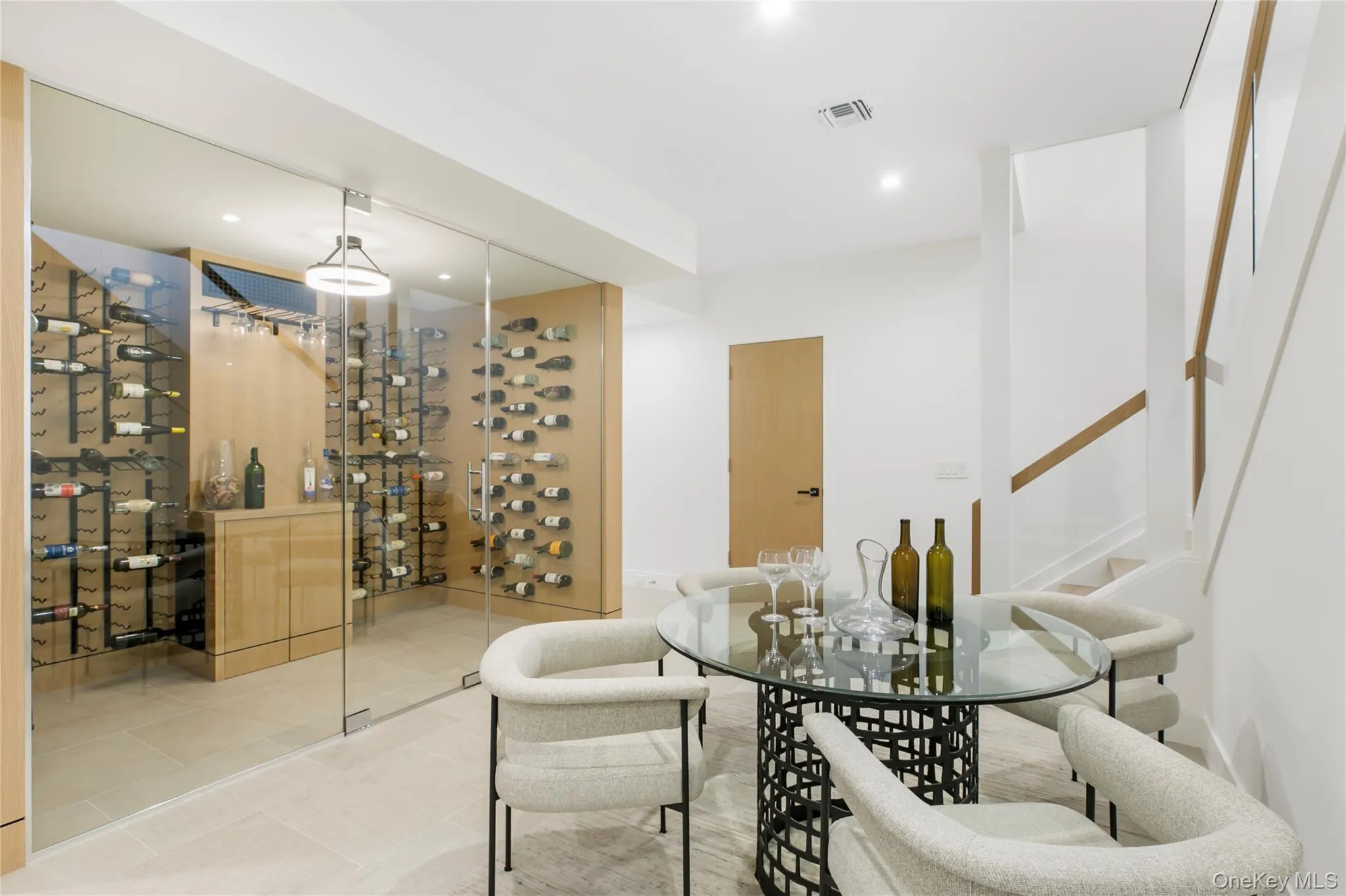 Wine room with recessed lighting and tile patterned flooring Wine room with recessed lighting and tile patterned flooring