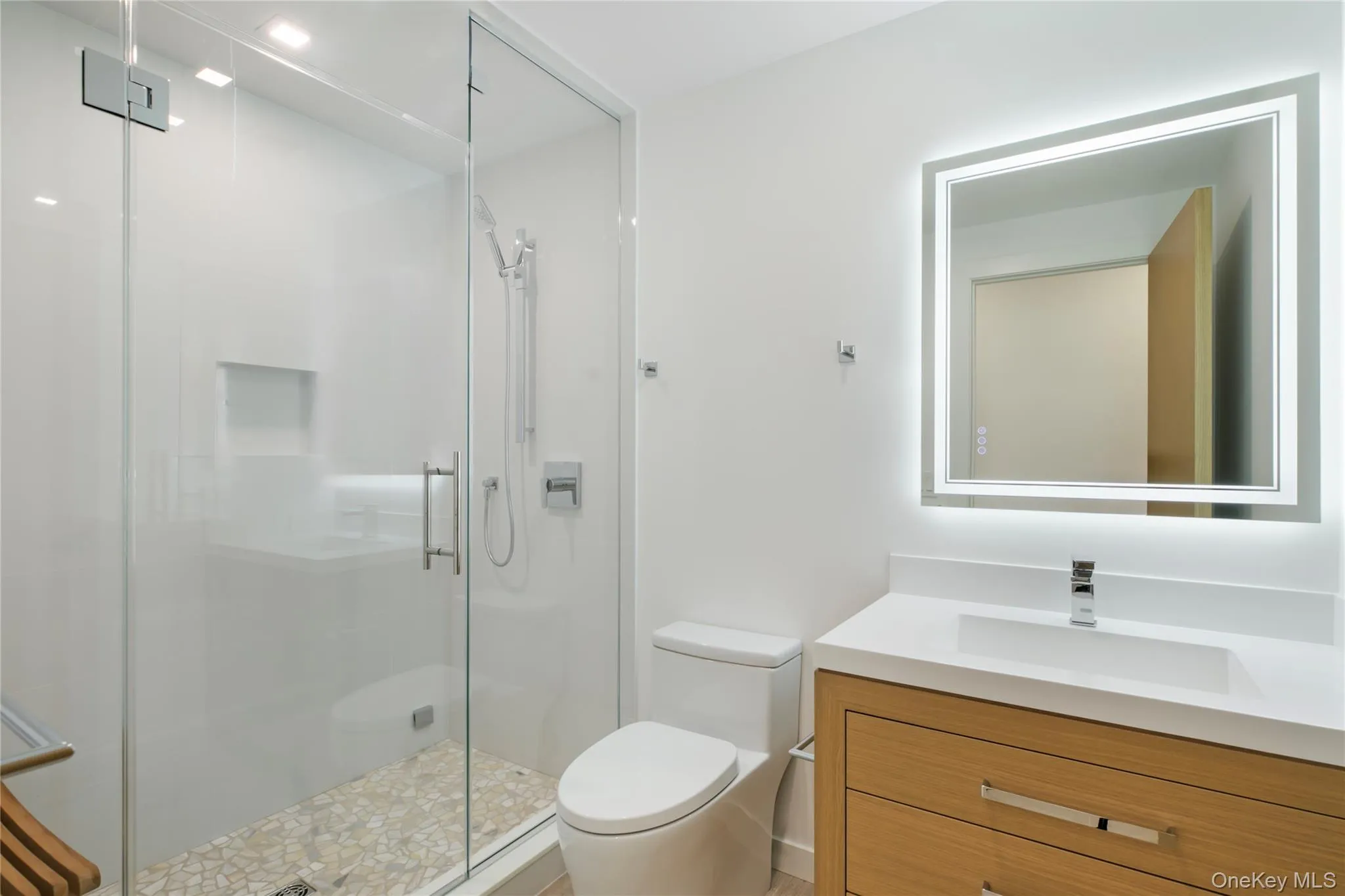Full bath featuring a stall shower and vanity Full bath featuring a stall shower and vanity