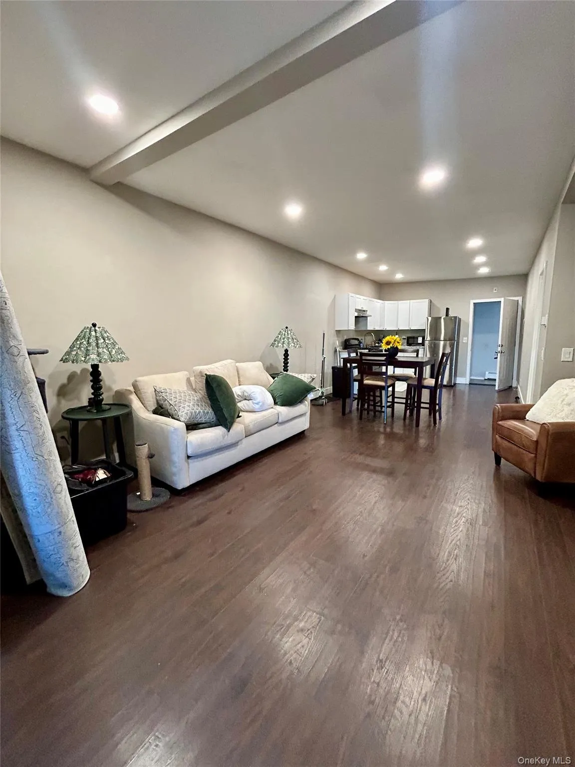 Living area featuring recessed lighting and dark wood-type flooring Living area featuring recessed lighting and dark wood-type flooring