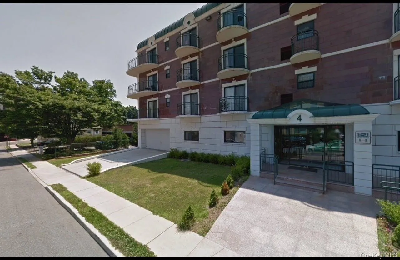 View of building exterior with a garage View of building exterior with a garage