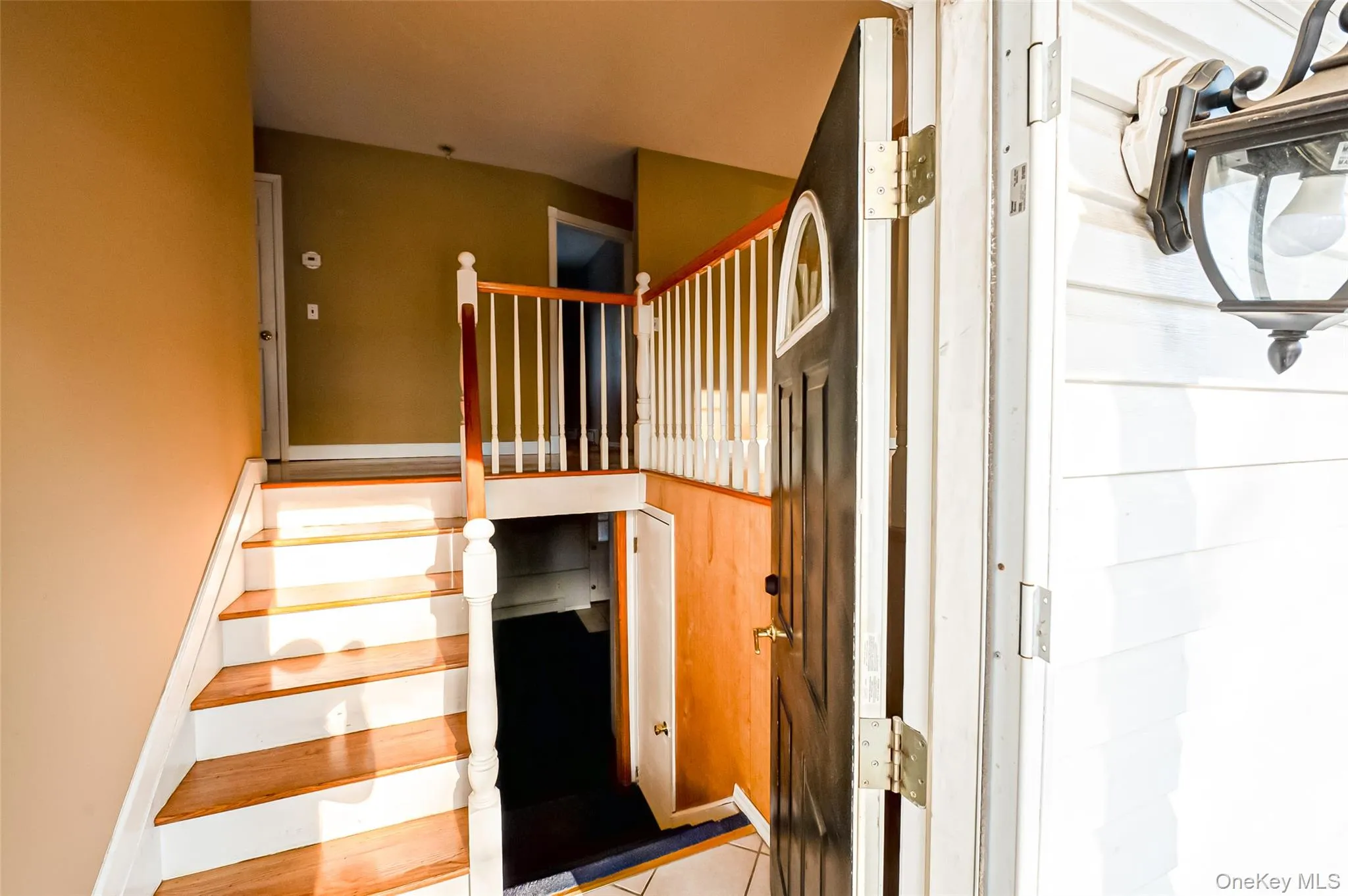 Stairs featuring tile patterned flooring Stairs featuring tile patterned flooring