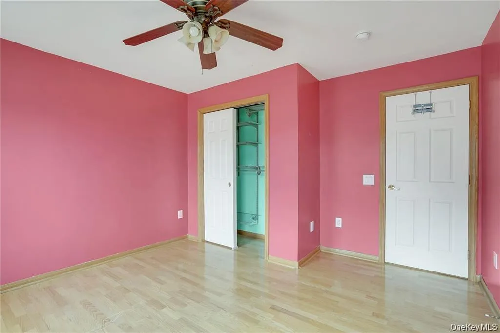 Unfurnished bedroom featuring light wood-style floors, a ceiling fan, and a closet Unfurnished bedroom featuring light wood-style floors, a ceiling fan, and a closet