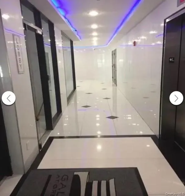 Hallway featuring elevator Hallway featuring elevator