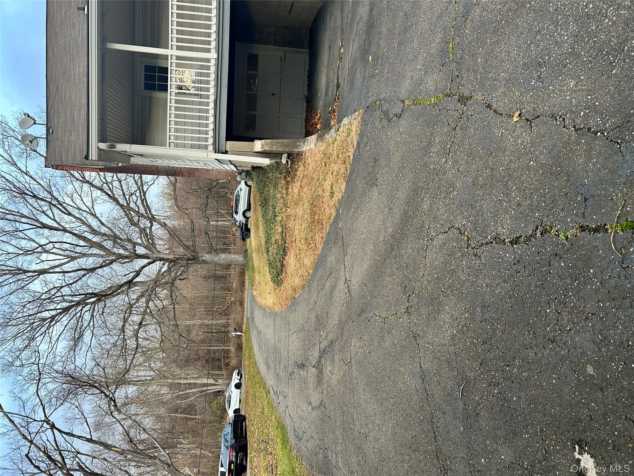 View of asphalt driveway View of asphalt driveway
