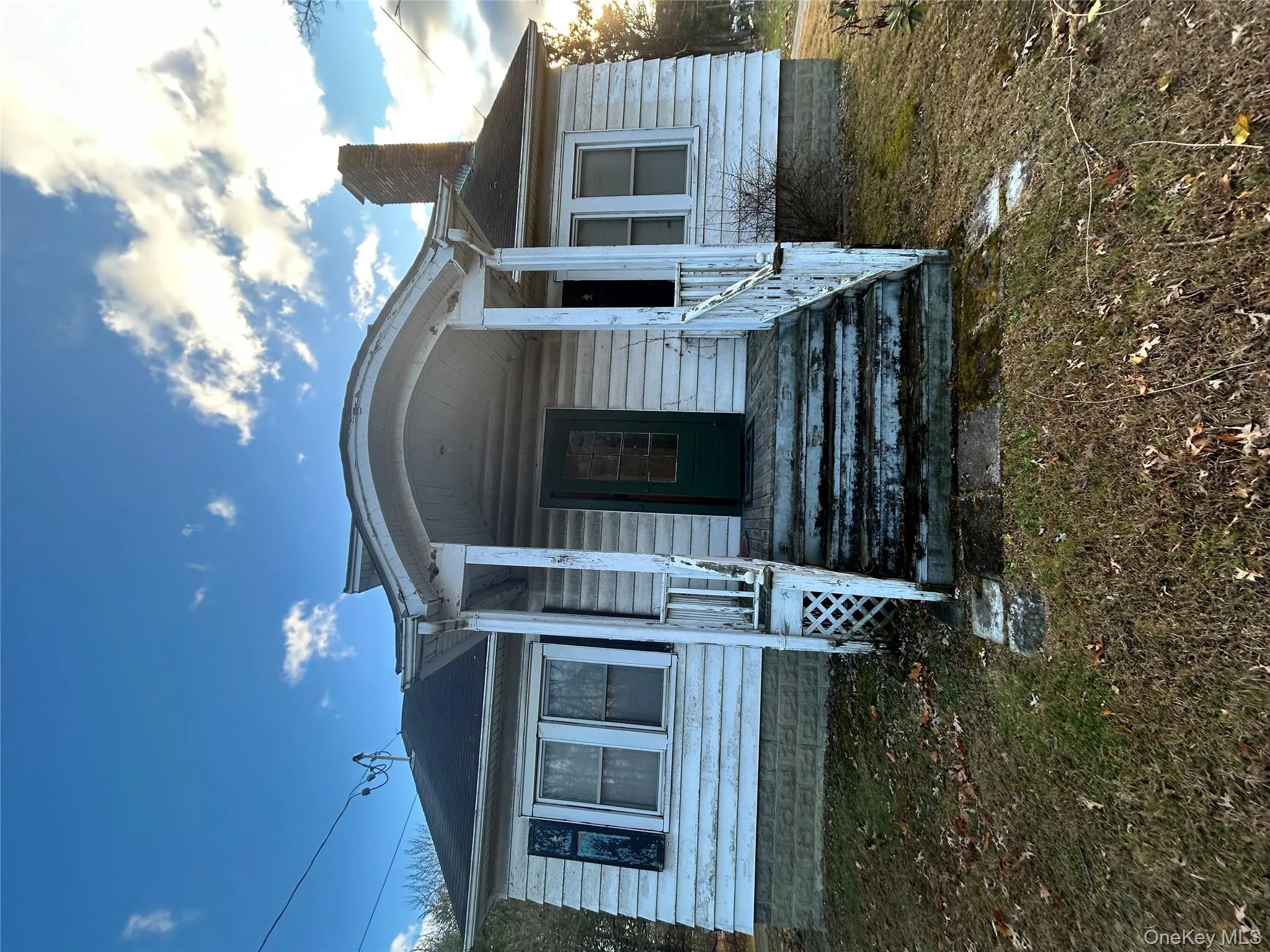 View of front of property with a chimney and a porch View of front of property with a chimney and a porch