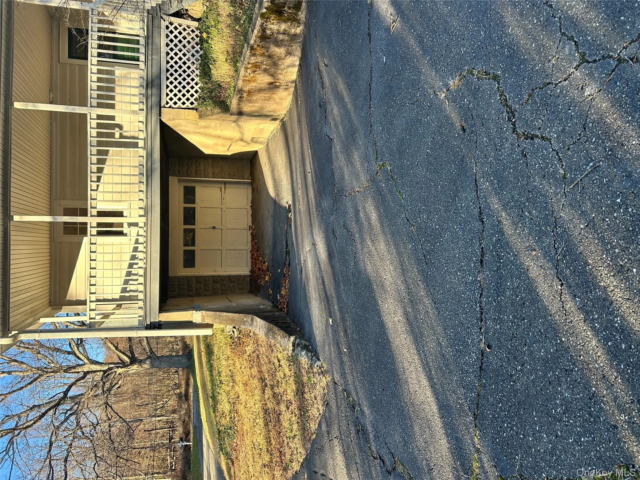 Garage featuring asphalt driveway Garage featuring asphalt driveway