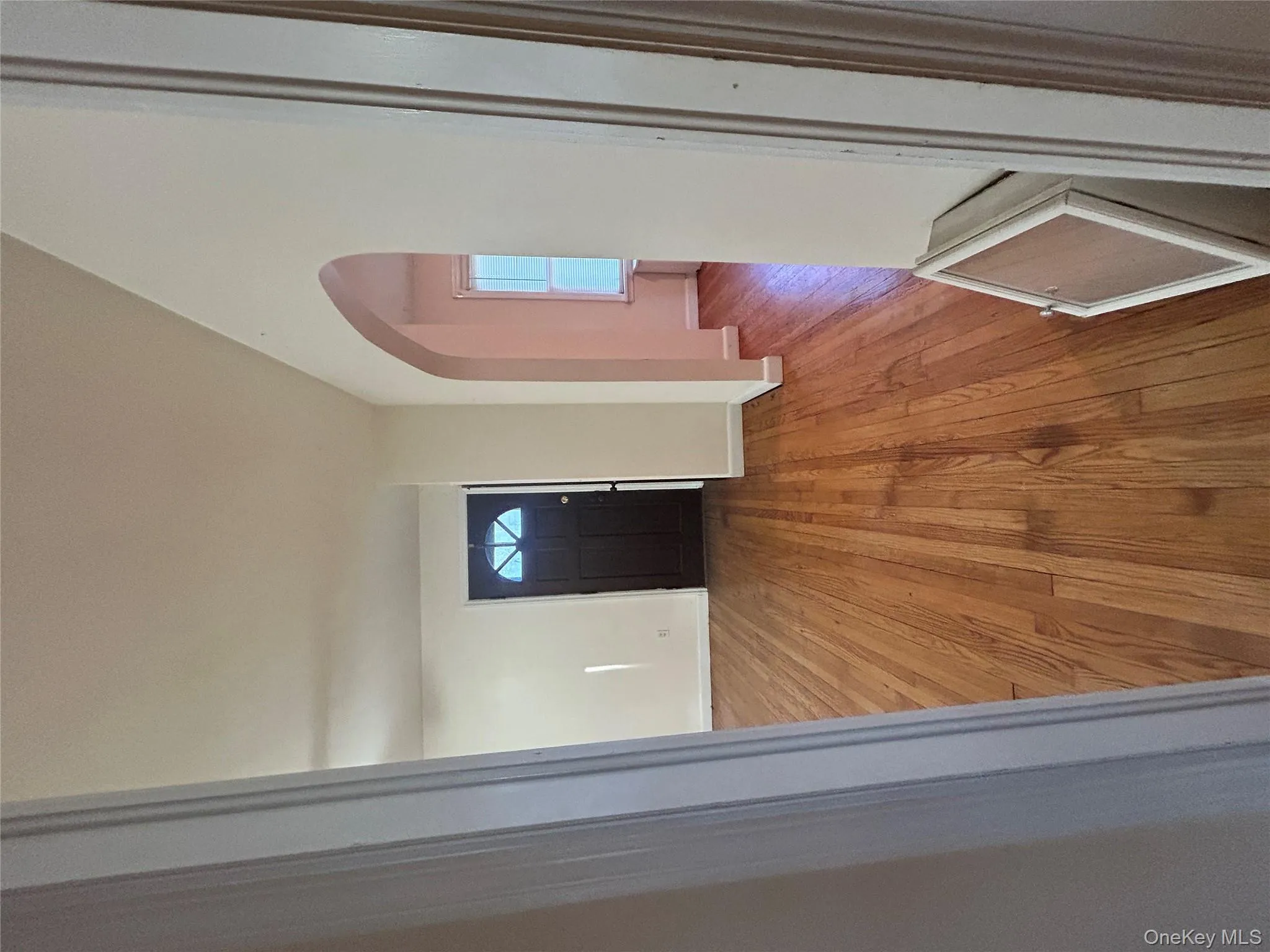 Foyer entrance with light wood-style floors and arched walkways Foyer entrance with light wood-style floors and arched walkways
