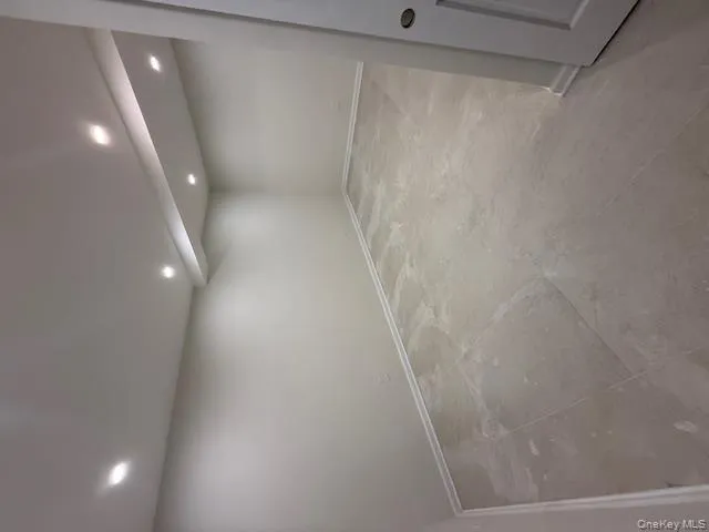 Finished basement with recessed lighting and baseboards Finished basement with recessed lighting and baseboards