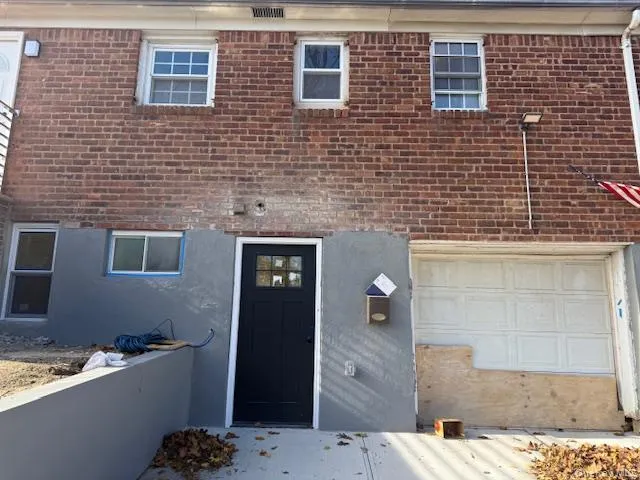 Entrance to property featuring brick siding Entrance to property featuring brick siding