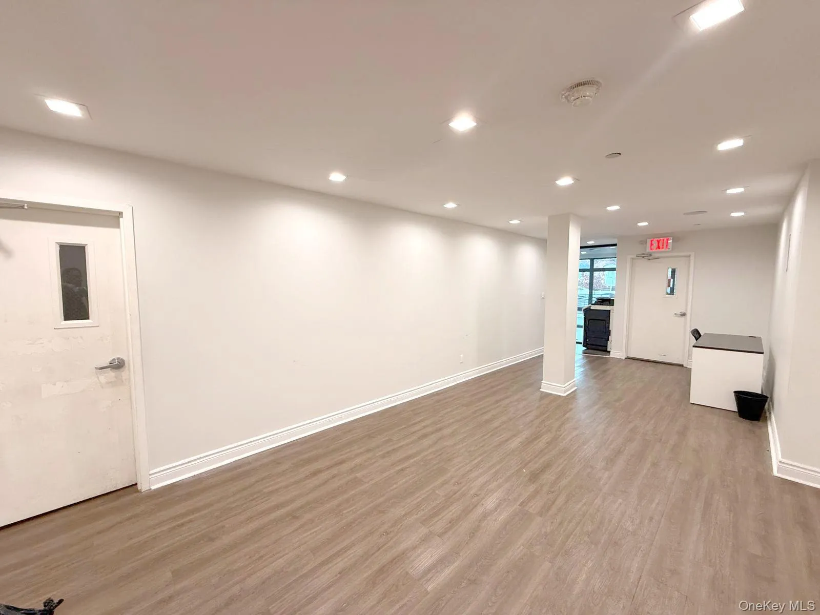 Below grade area with light wood finished floors and recessed lighting Below grade area with light wood finished floors and recessed lighting