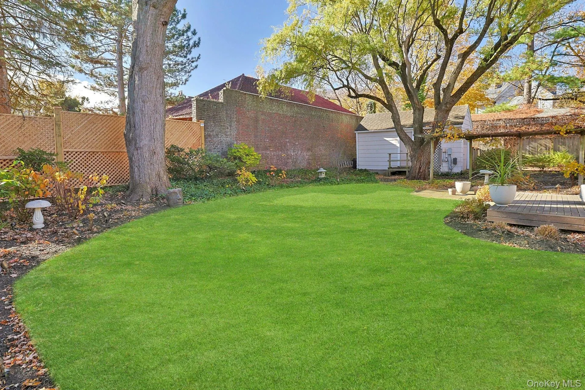 View of yard featuring a wooden deck View of yard featuring a wooden deck