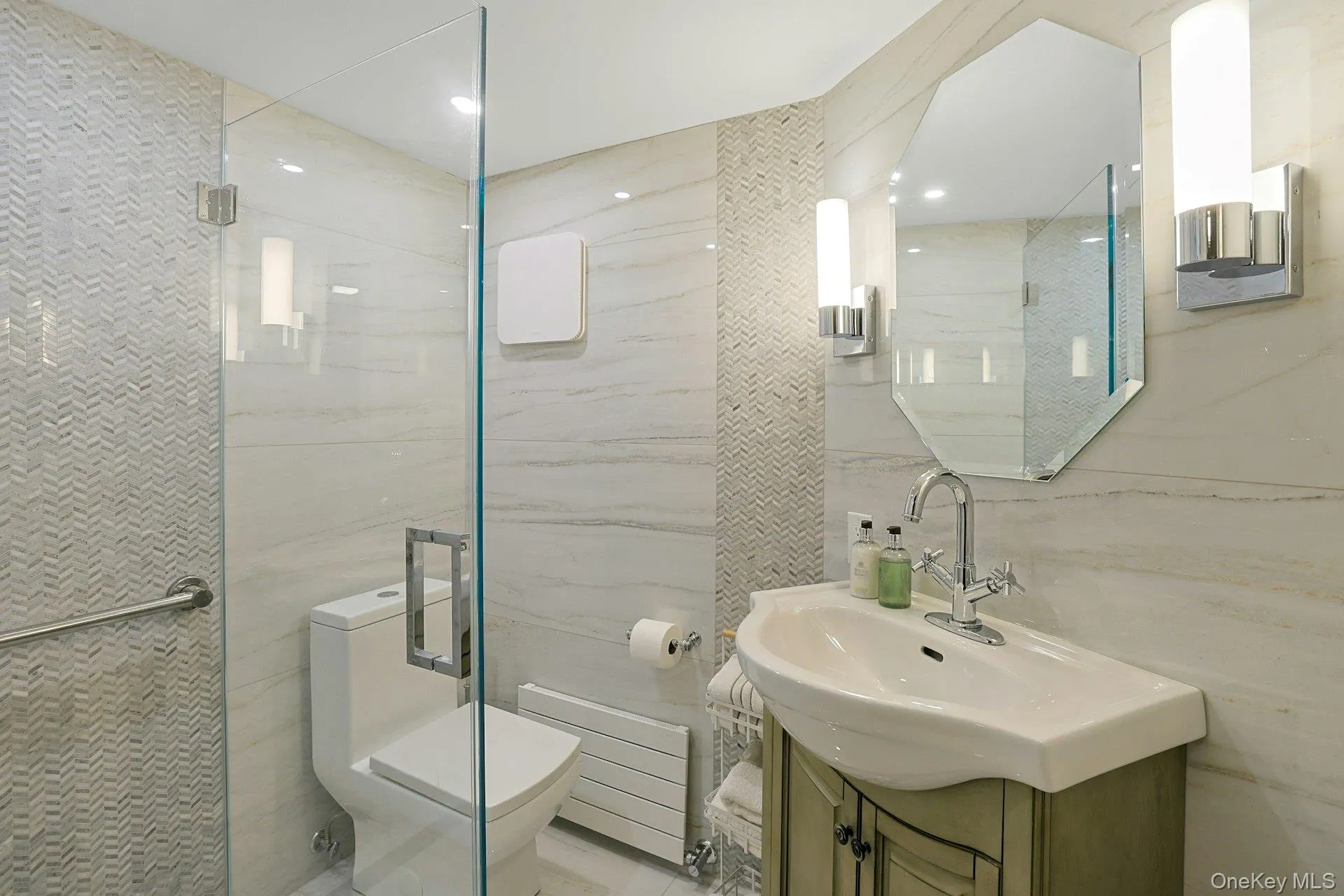 Full bathroom with tile walls, radiator, vanity, and a stall shower Full bathroom with tile walls, radiator, vanity, and a stall shower