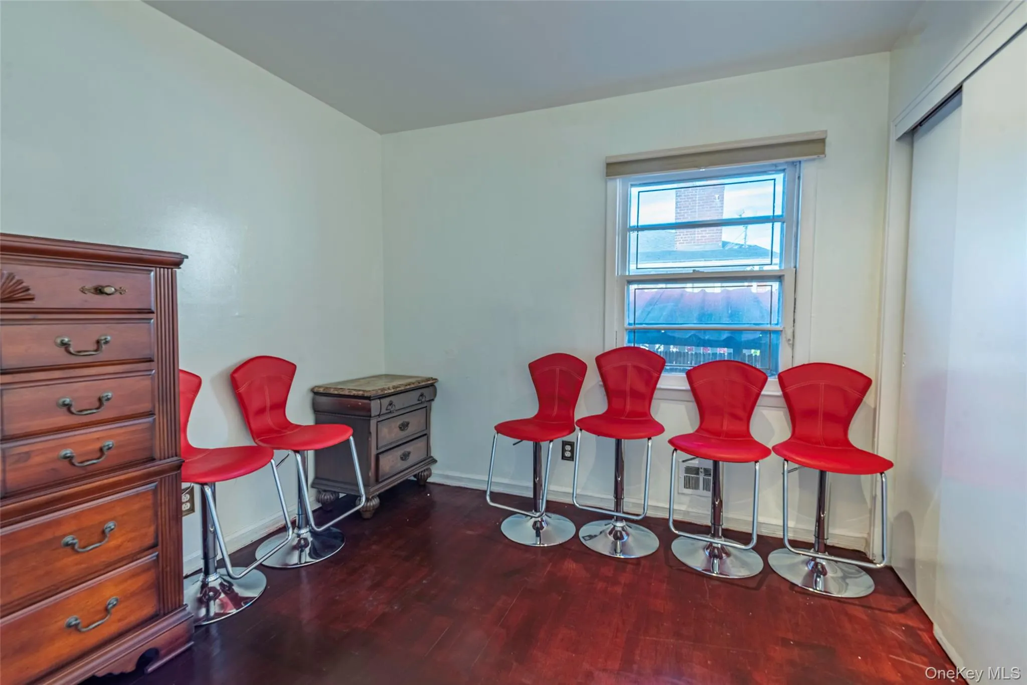 Dining area with dark wood finished floors and baseboards Dining area with dark wood finished floors and baseboards