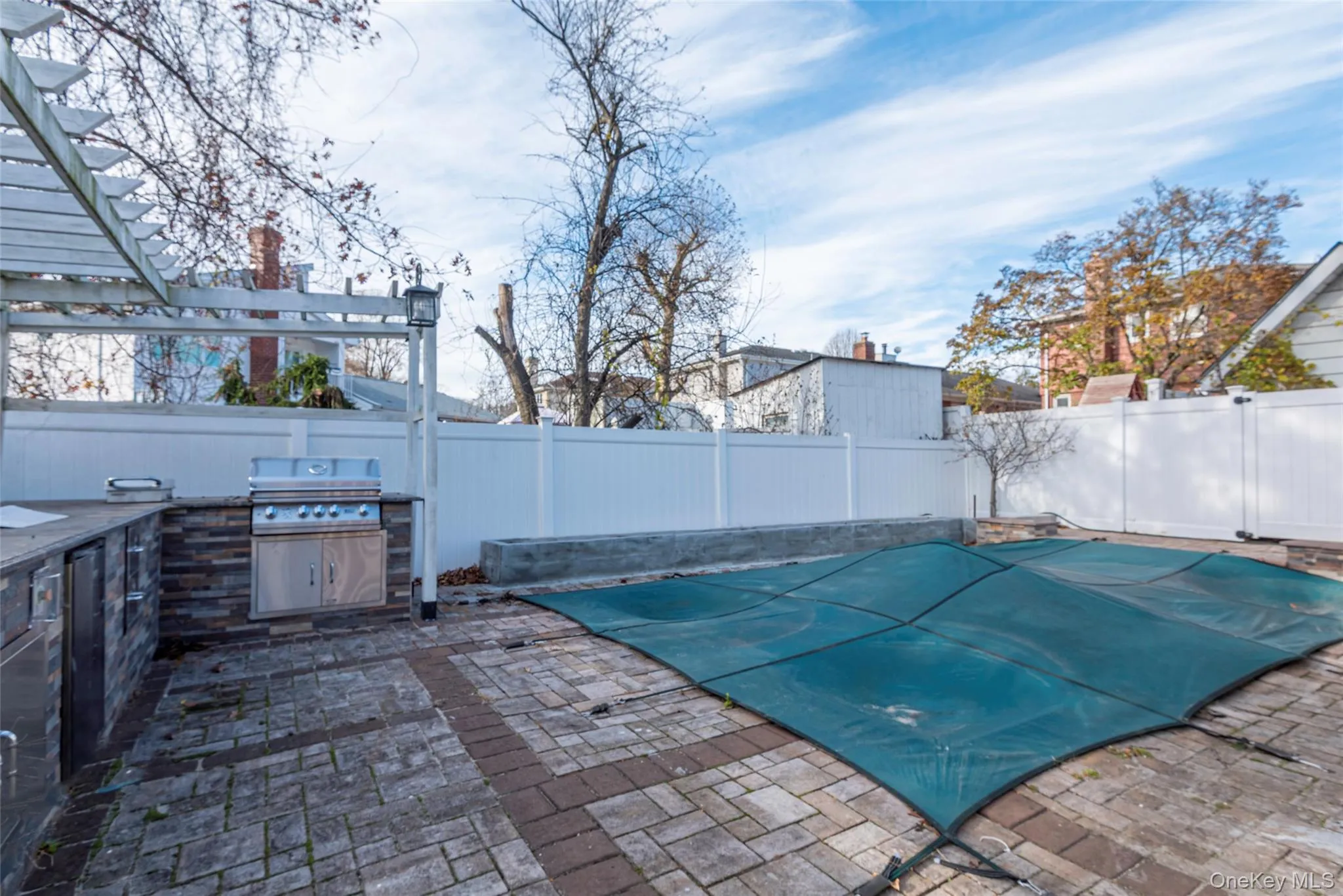 View of swimming pool with a fenced backyard, a patio area, and area for grilling View of swimming pool with a fenced backyard, a patio area, and area for grilling
