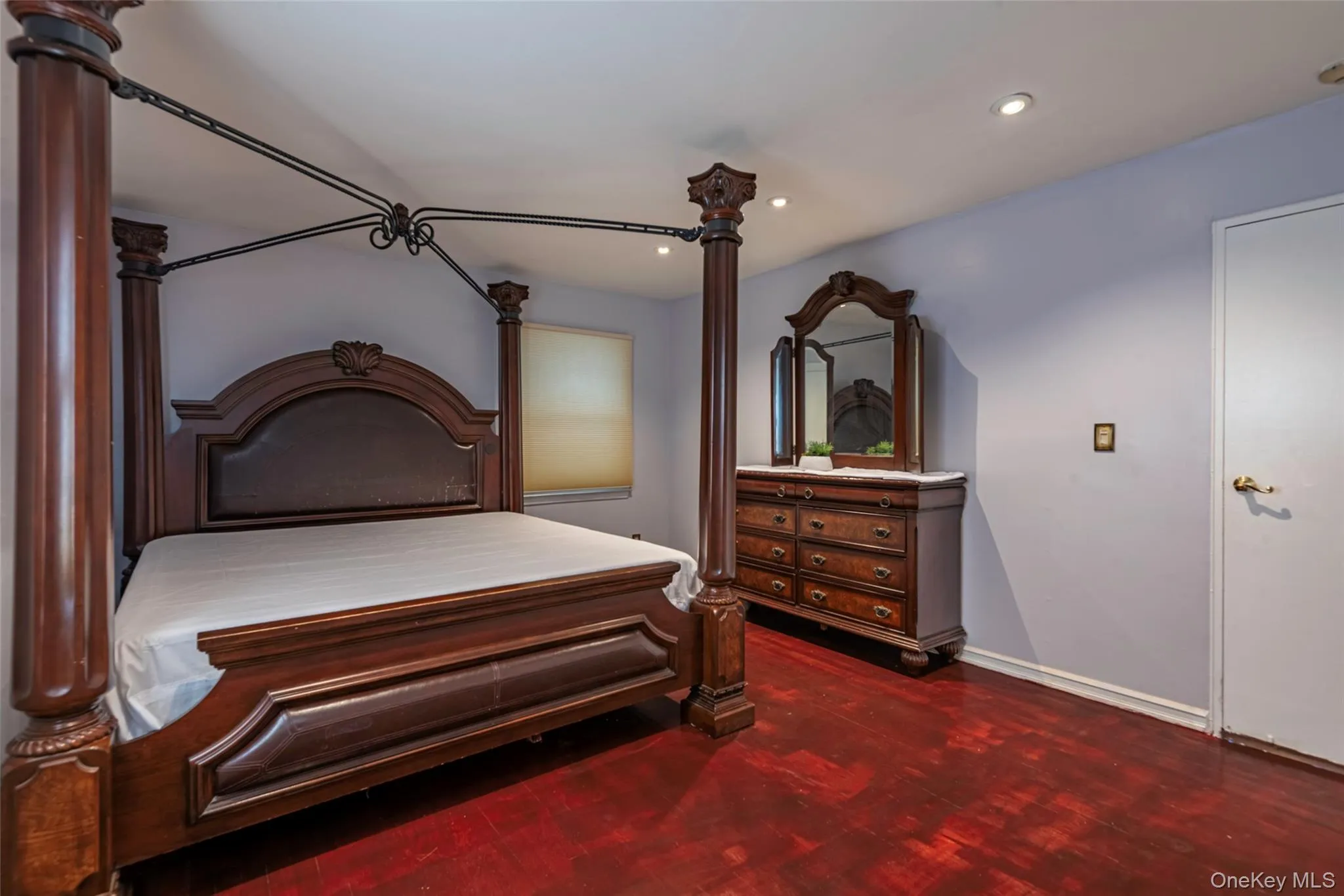 Bedroom with recessed lighting and dark wood finished floors Bedroom with recessed lighting and dark wood finished floors