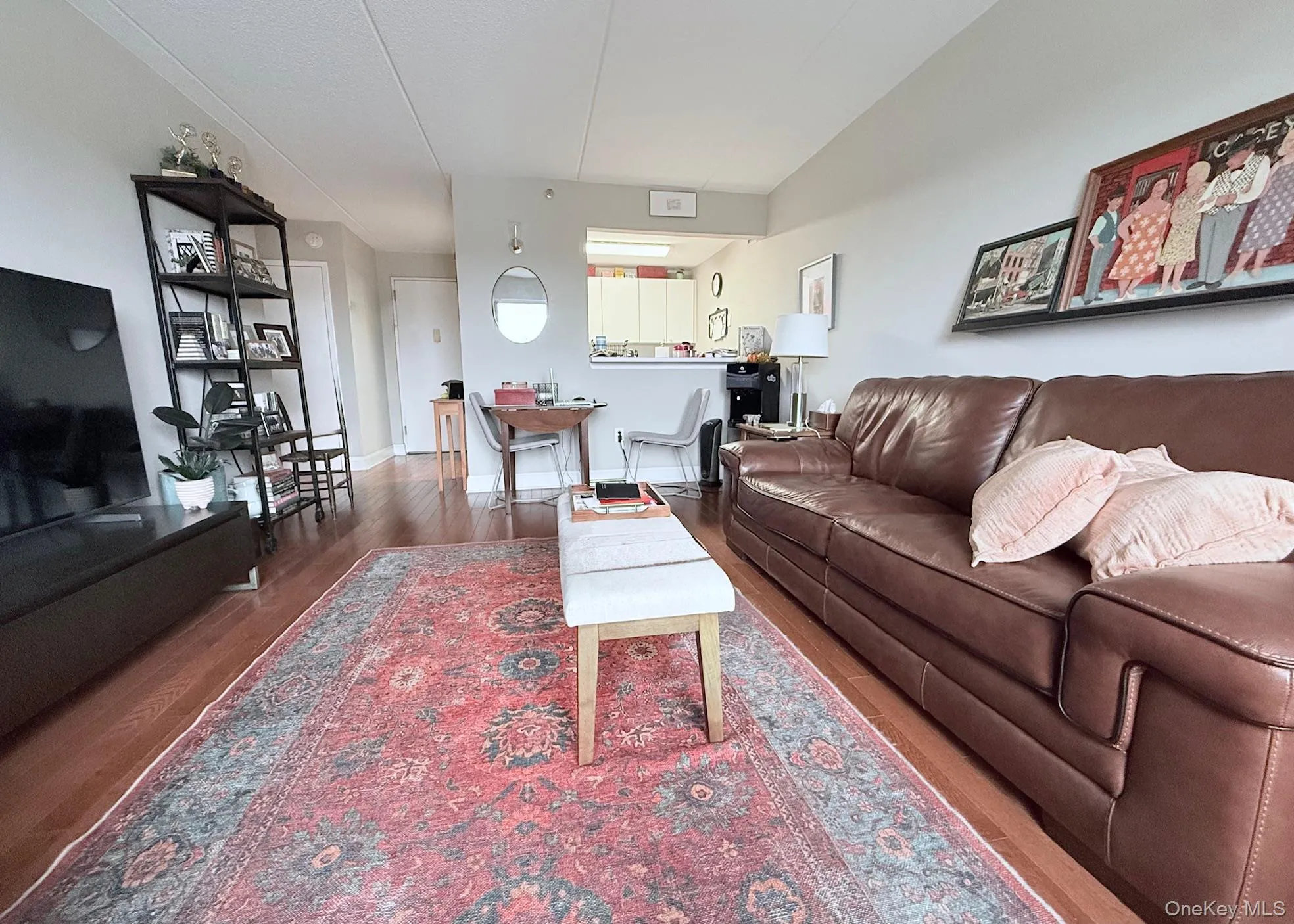 Living area with wood finished floors and baseboards Living area with wood finished floors and baseboards