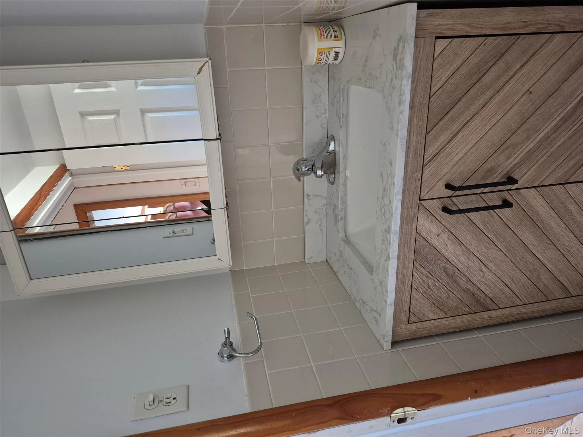 Bathroom with vanity and tile walls Bathroom with vanity and tile walls