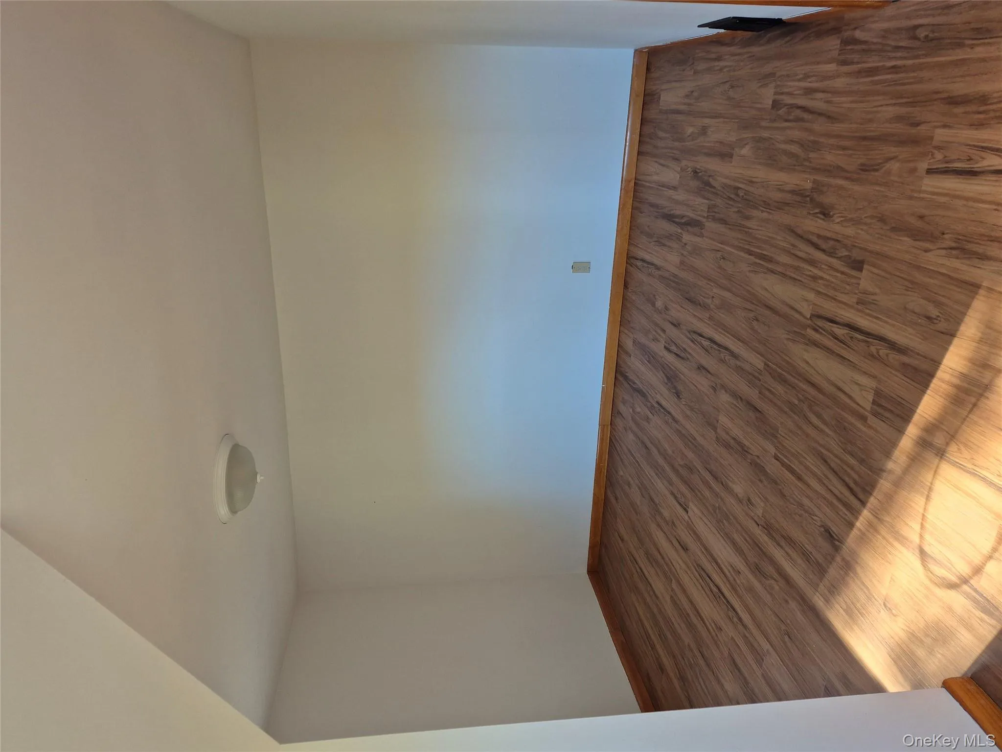Unfurnished room with wood finished floors Unfurnished room with wood finished floors