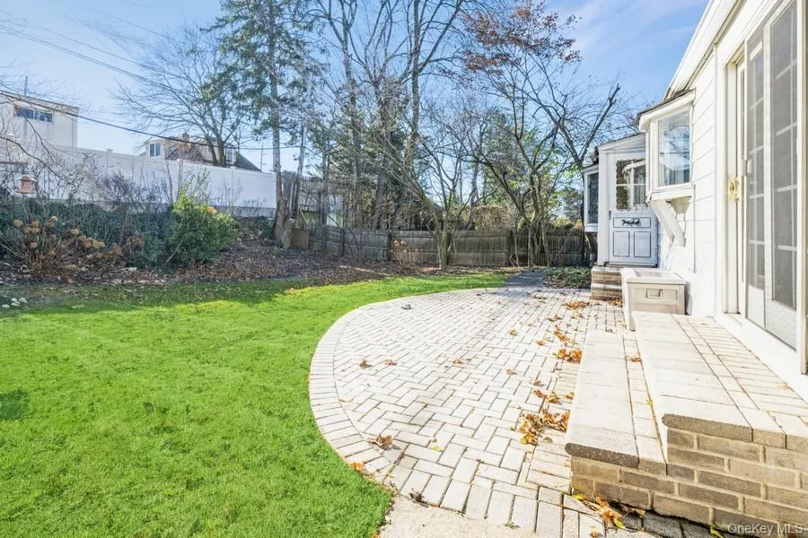 Fenced backyard featuring a patio area Fenced backyard featuring a patio area