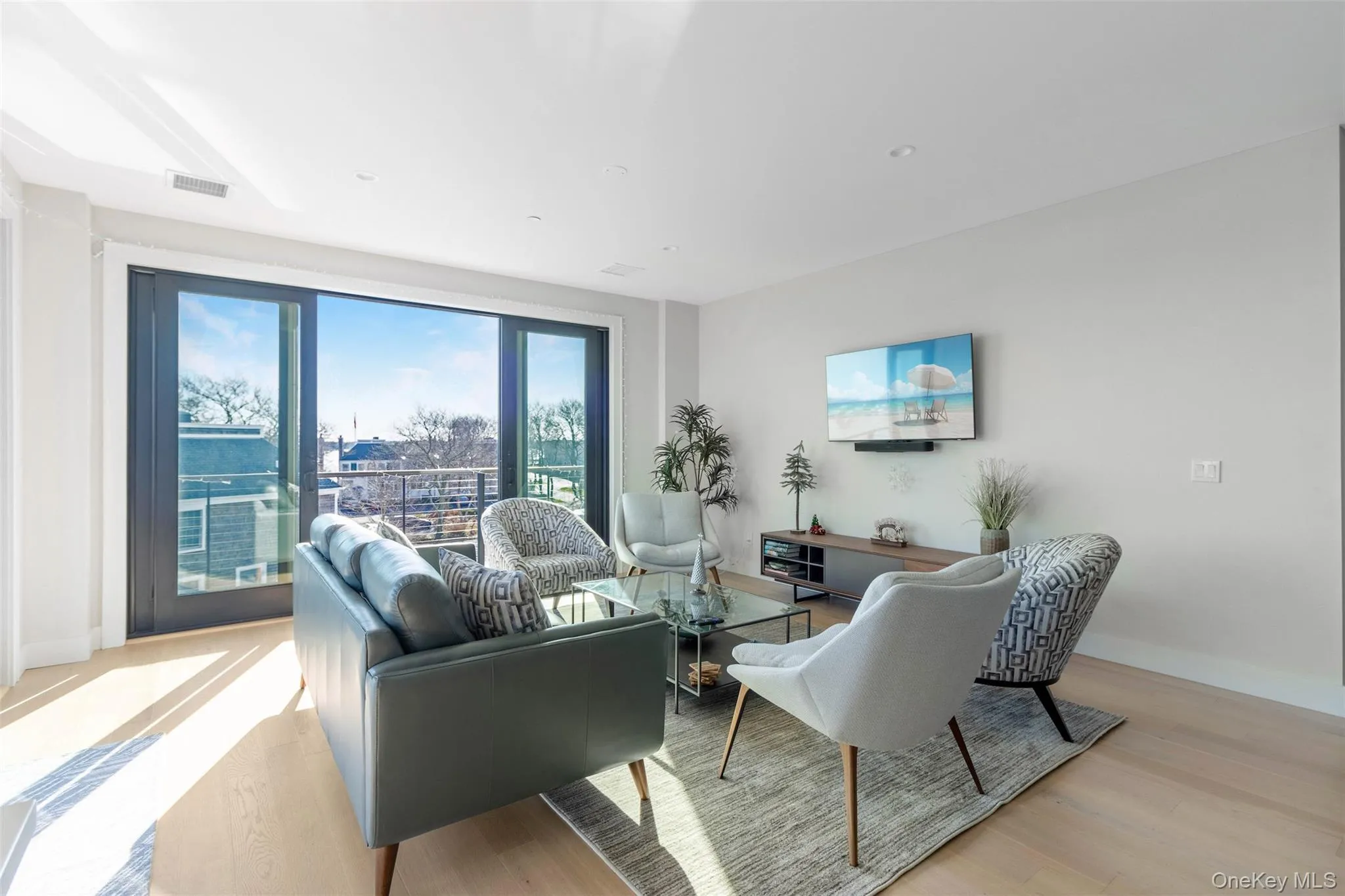Living area featuring light wood finished floors and baseboards Living area featuring light wood finished floors and baseboards