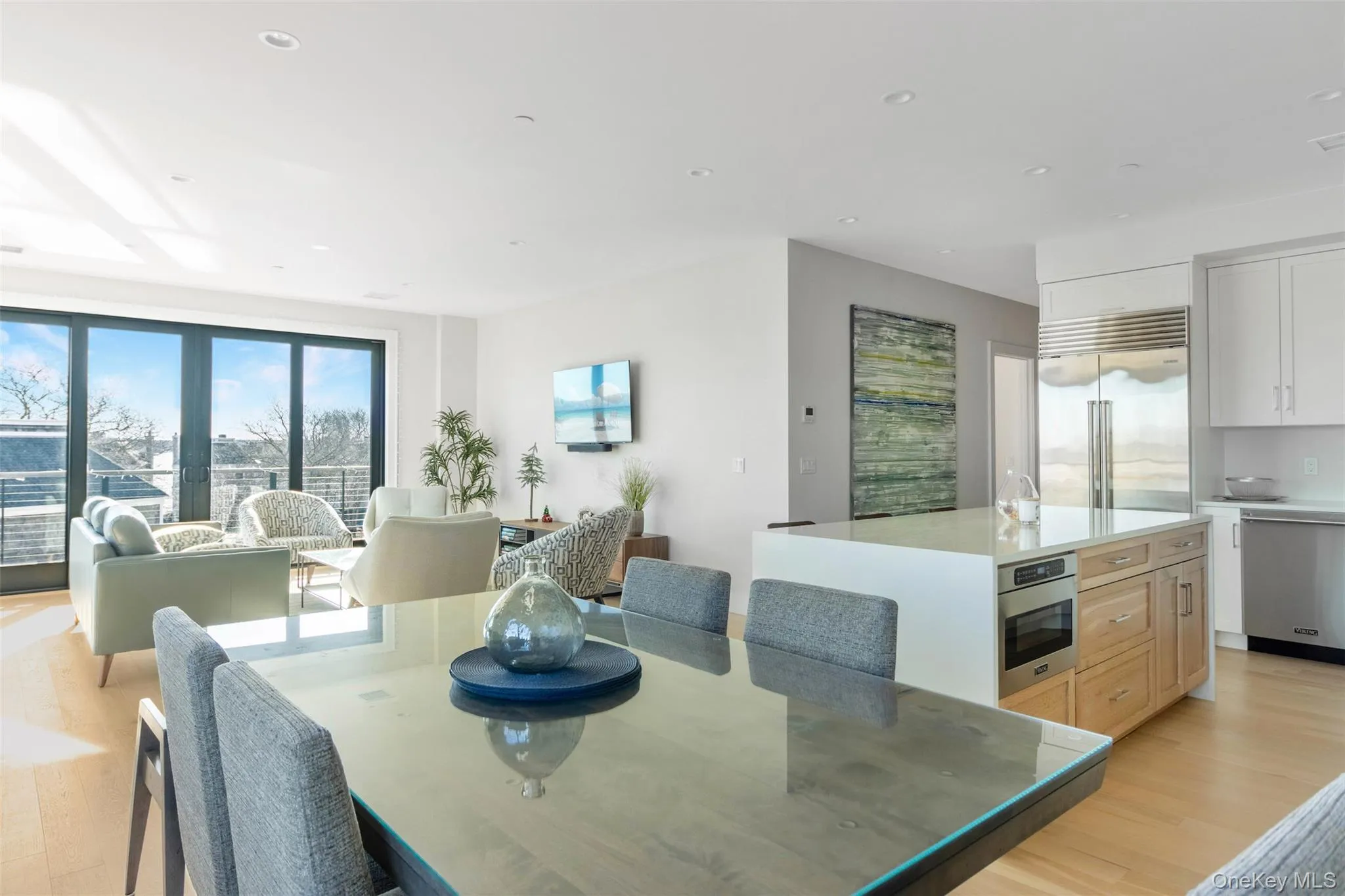 Dining space with light wood-style flooring and recessed lighting Dining space with light wood-style flooring and recessed lighting