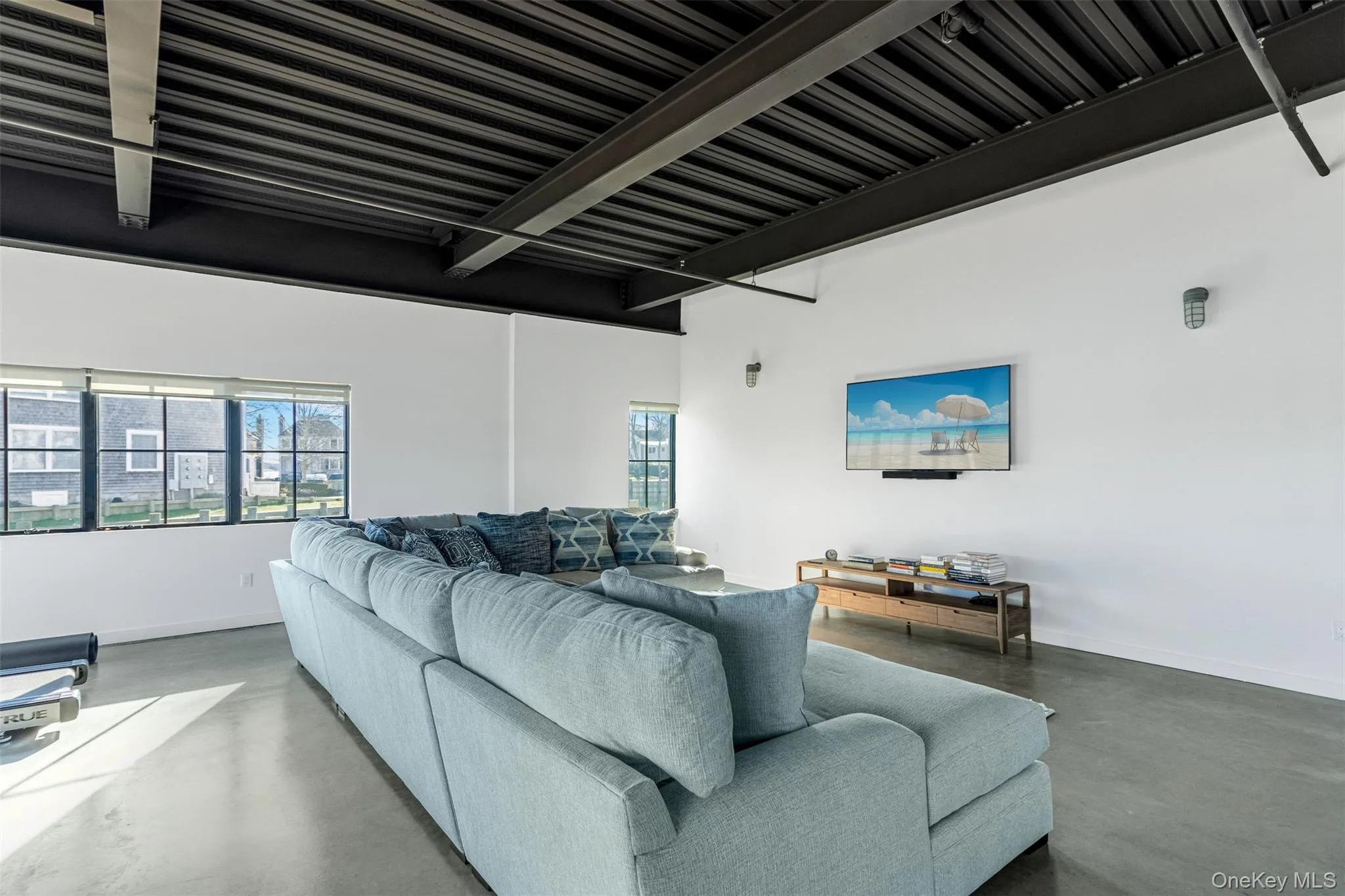 Living area with concrete flooring Living area with concrete flooring