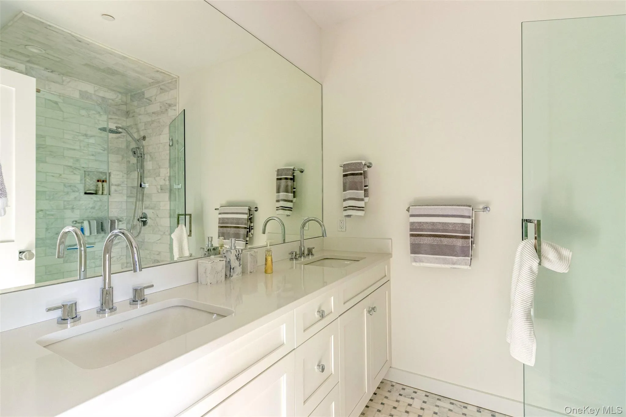 Bathroom with a stall shower and double vanity Bathroom with a stall shower and double vanity