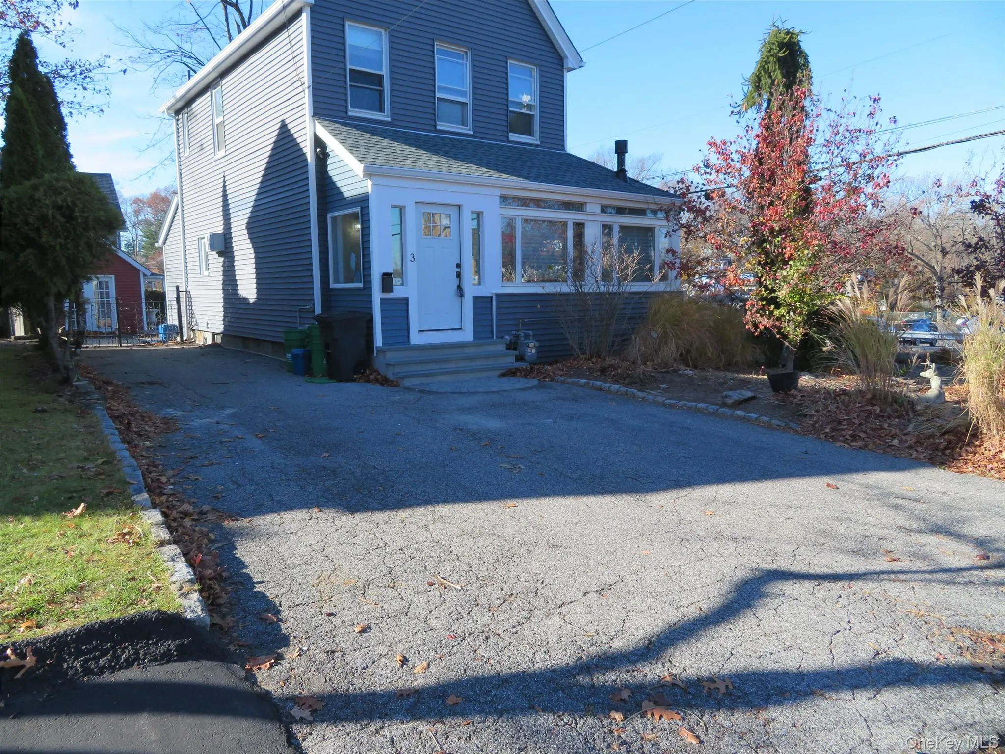 View of front of house with asphalt driveway, entry steps, and a shingled roof View of front of house with asphalt driveway, entry steps, and a shingled roof