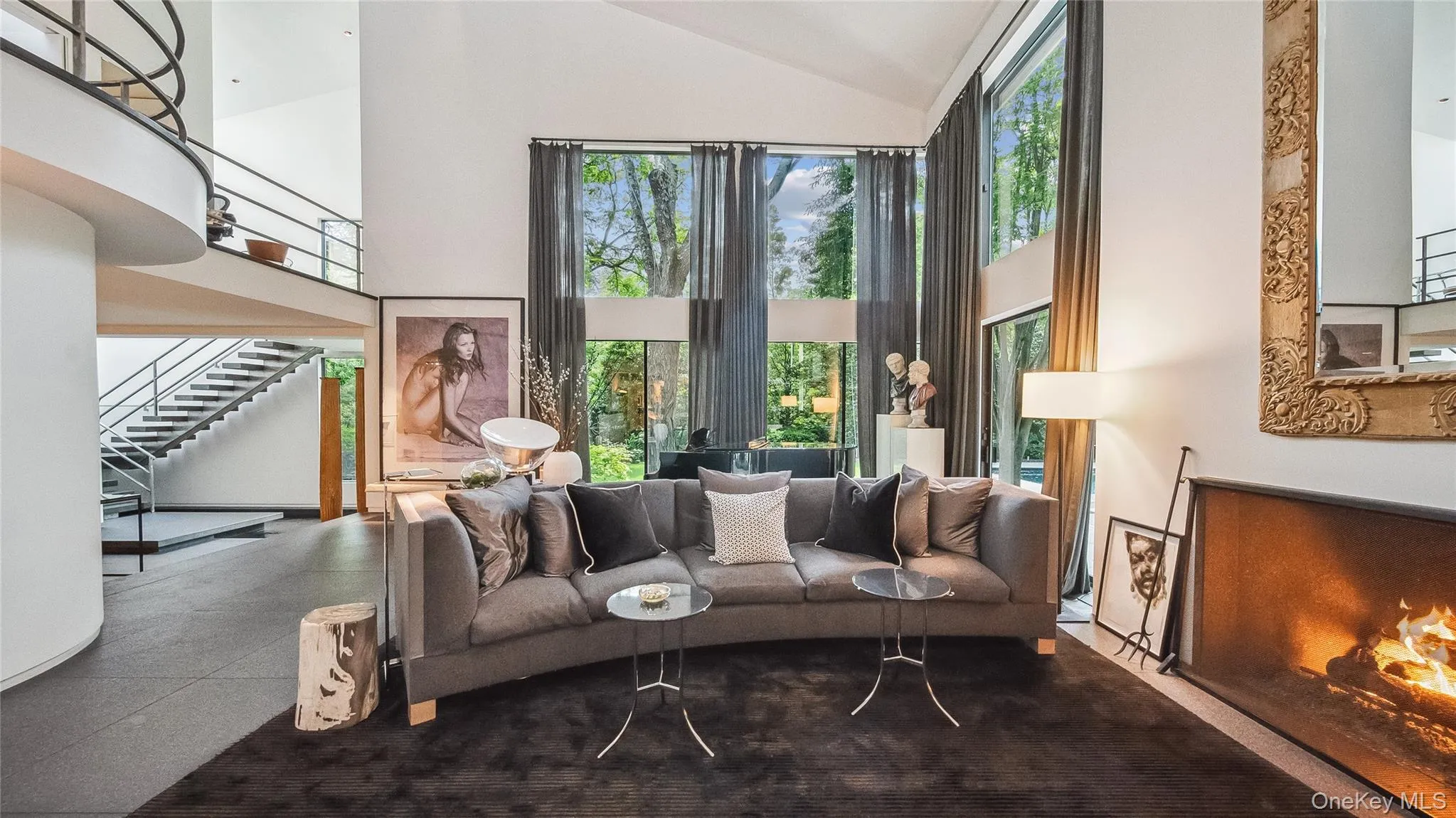 Main Living Area With Double Height Ceilings and Gas Fireplace Main Living Area With Double Height Ceilings and Gas Fireplace