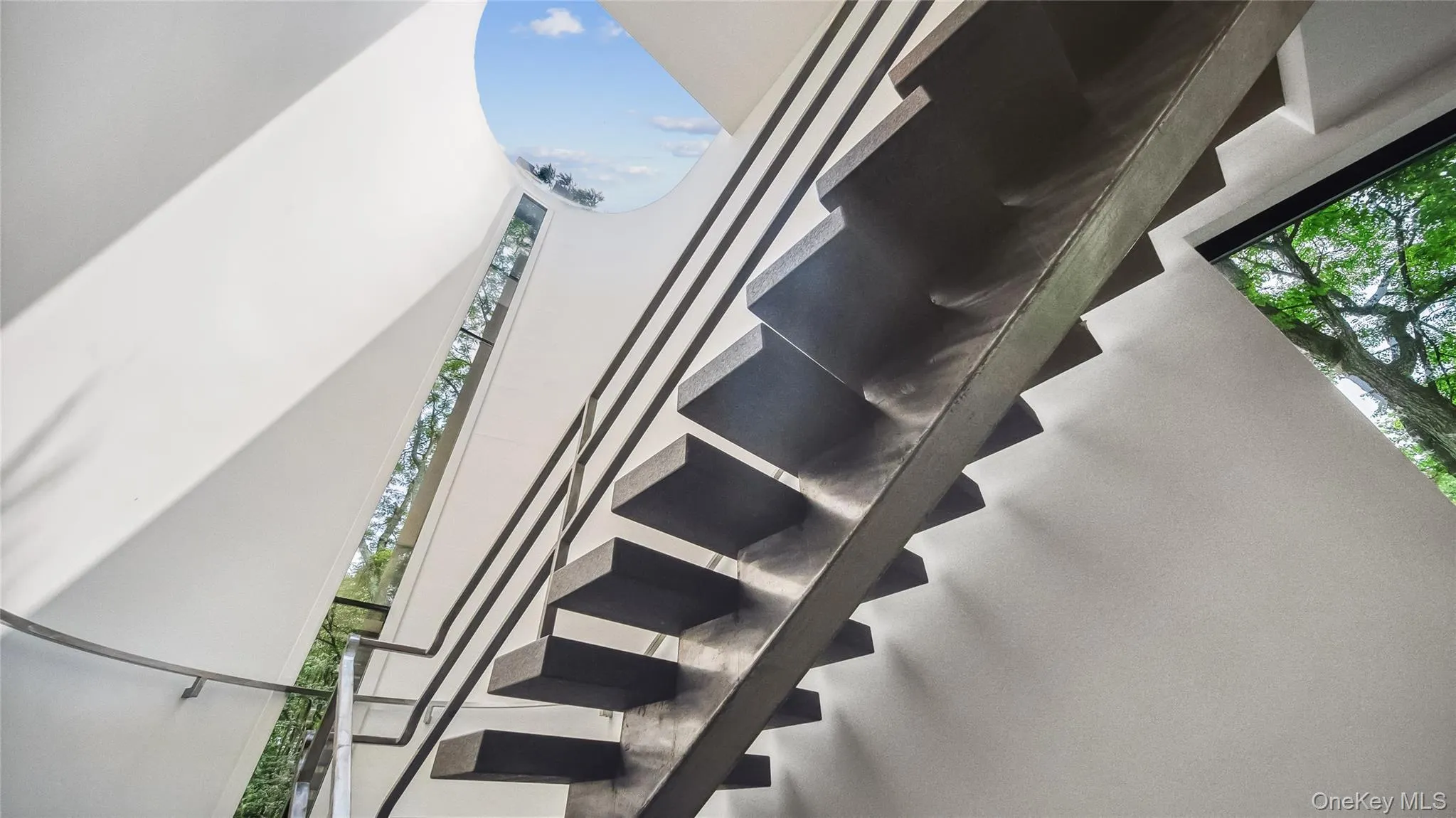 Sculptural Staircase With Cantilevered Granite Steps Sculptural Staircase With Cantilevered Granite Steps