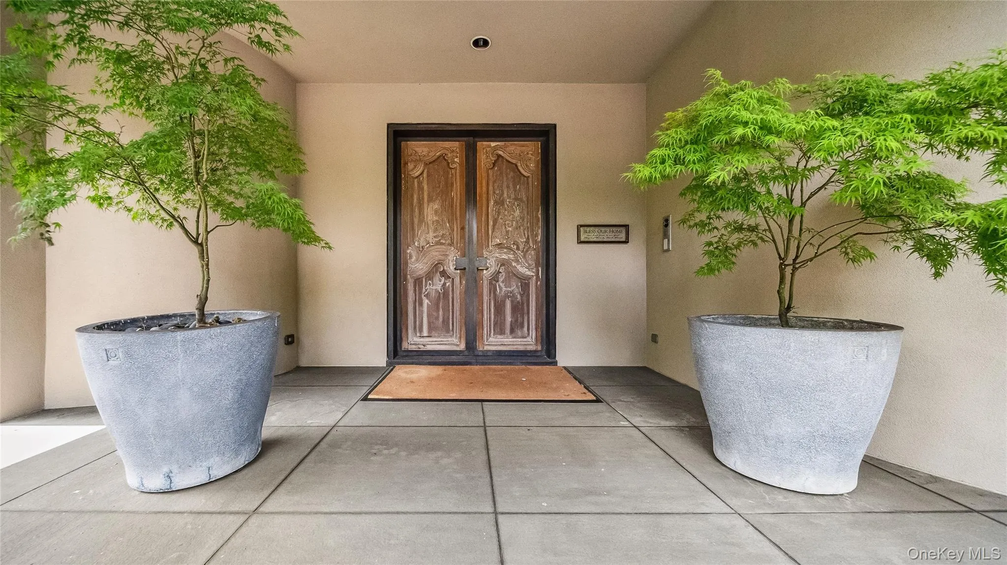 Entrance To The Interior Featuring Custom French Chateau Doors Set In Custom Bronze Metal Surround Entrance To The Interior Featuring Custom French Chateau Doors Set In Custom Bronze Metal Surround