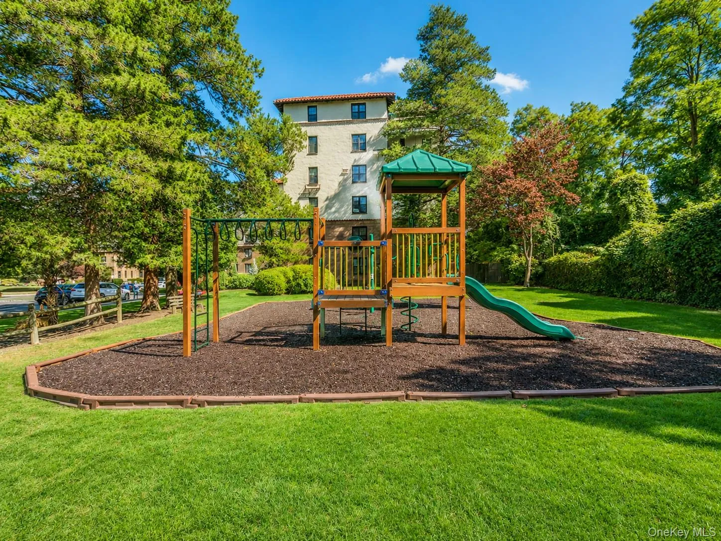 Community playground featuring a lawn Community playground featuring a lawn