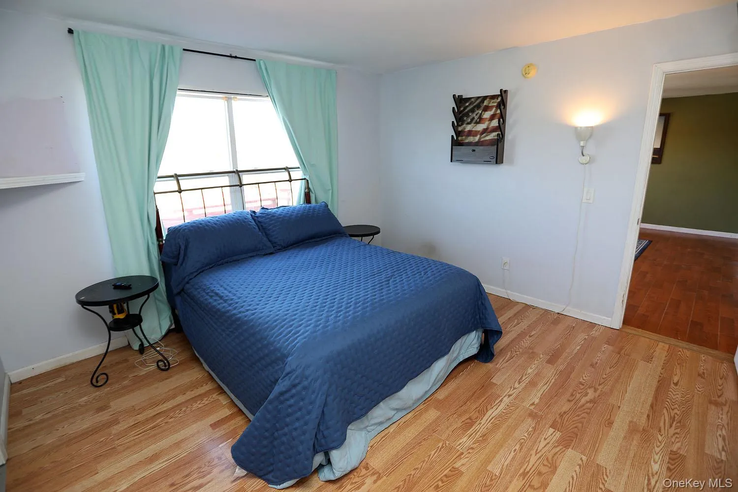 Bedroom featuring light wood-style flooring Bedroom featuring light wood-style flooring
