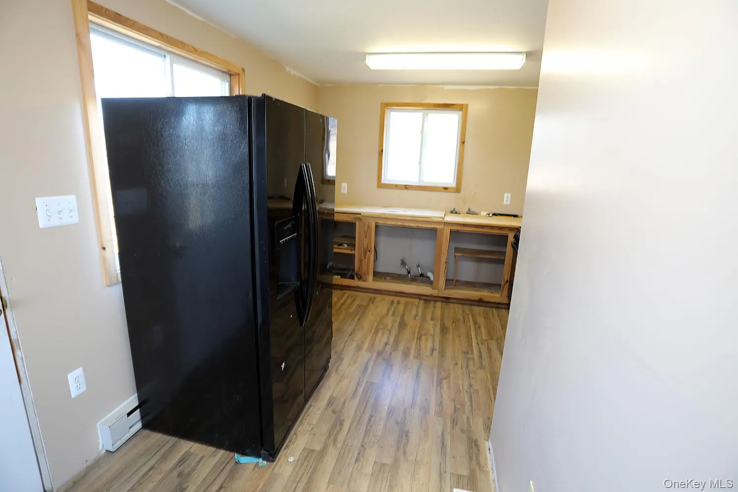 Apartment Kitchen featuring black refrigerator Apartment Kitchen featuring black refrigerator