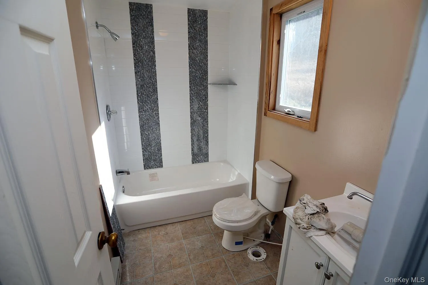 Bathroom in apartment featuring vanity, toilet and tub/shower combination, Bathroom in apartment featuring vanity, toilet and tub/shower combination,