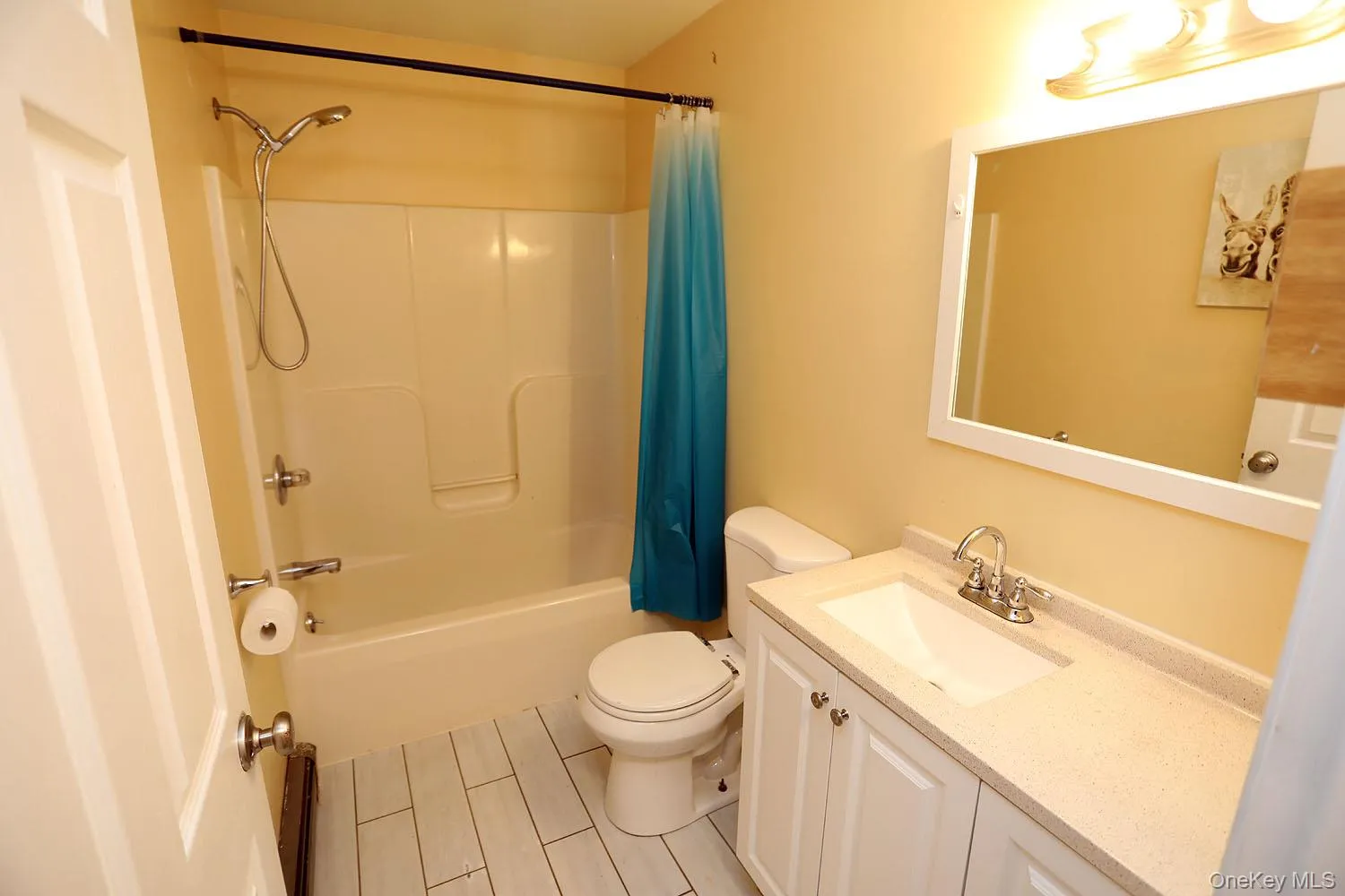 Bathroom featuring vanity and shower / bathtub combination Bathroom featuring vanity and shower / bathtub combination
