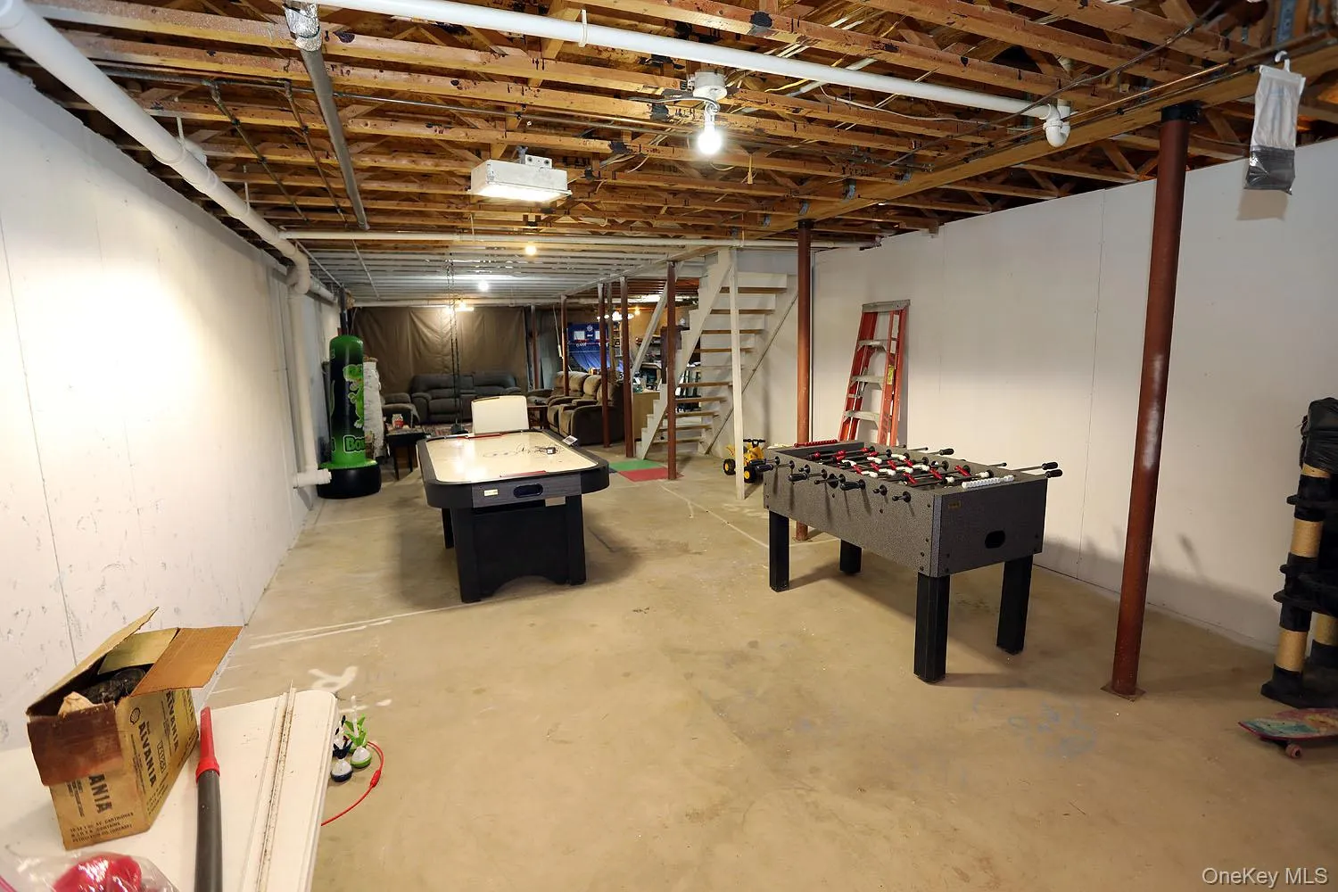 Unfinished basement with stairs Unfinished basement with stairs