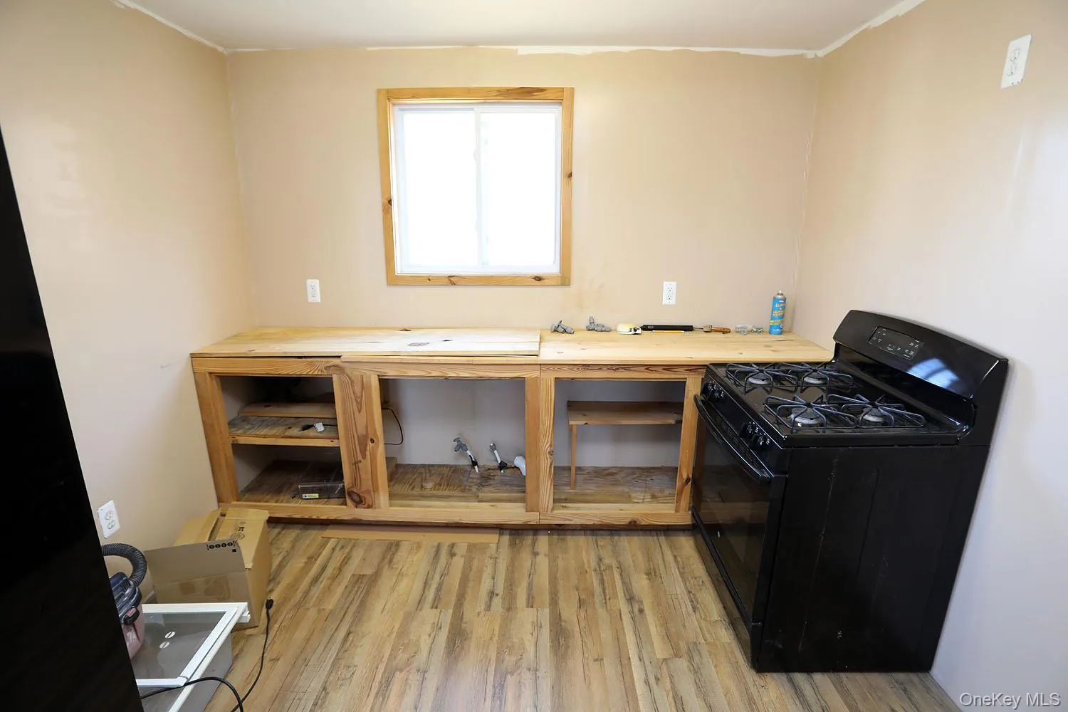 Kitchen located in apartment with gas stove Kitchen located in apartment with gas stove