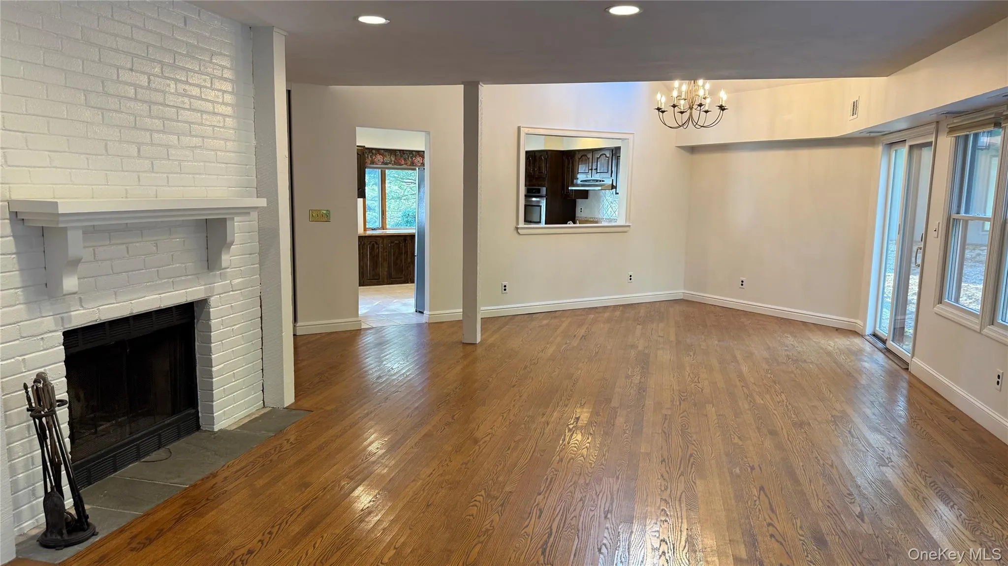 Living Room/Dining Room Area with Geaming Hardwood Floors Living Room/Dining Room Area with Geaming Hardwood Floors