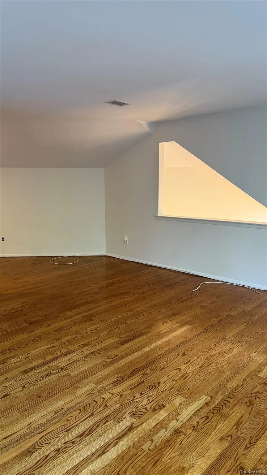 Large Primary Bedroom w/Gleaming Hardwood Floors Large Primary Bedroom w/Gleaming Hardwood Floors