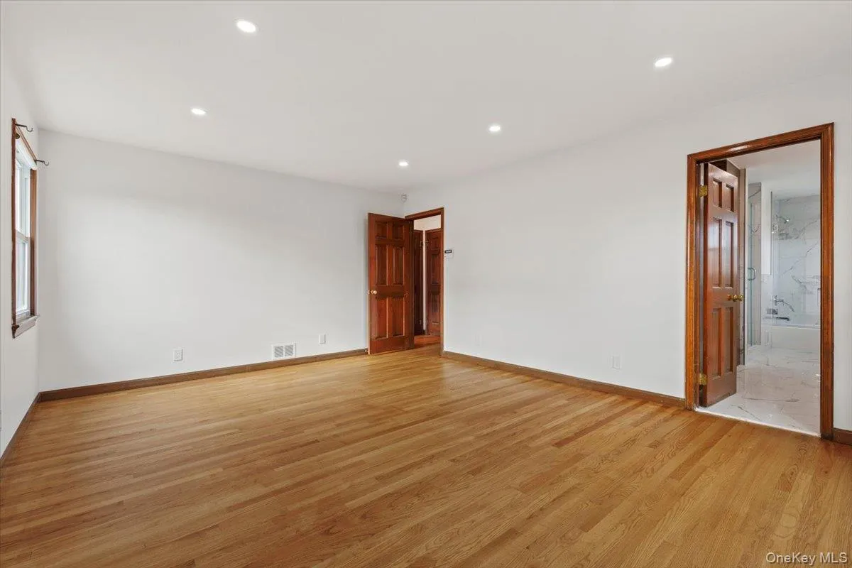Spare room featuring light wood-style flooring and recessed lighting Spare room featuring light wood-style flooring and recessed lighting
