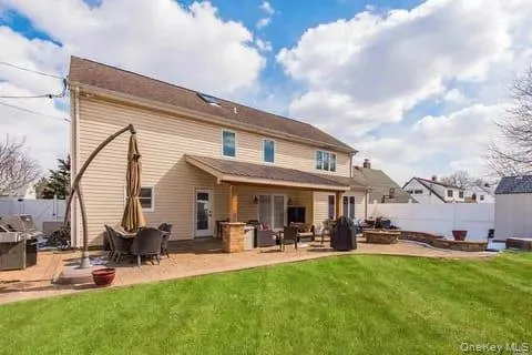 Back of property featuring a patio area and an outdoor structure Back of property featuring a patio area and an outdoor structure