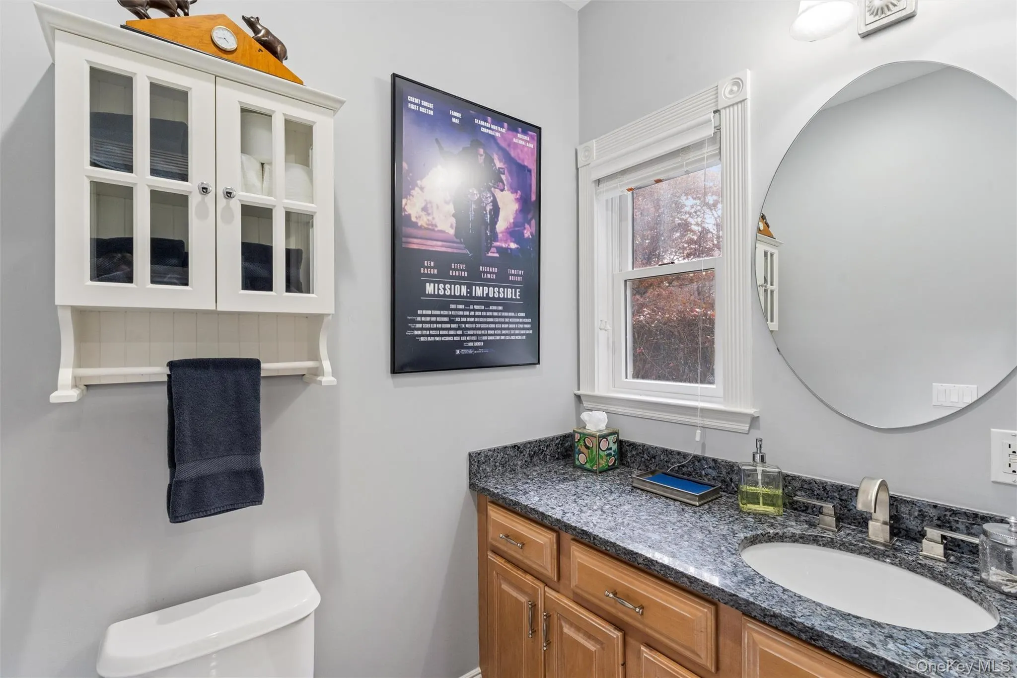 Half bath featuring vanity and toilet Half bath featuring vanity and toilet